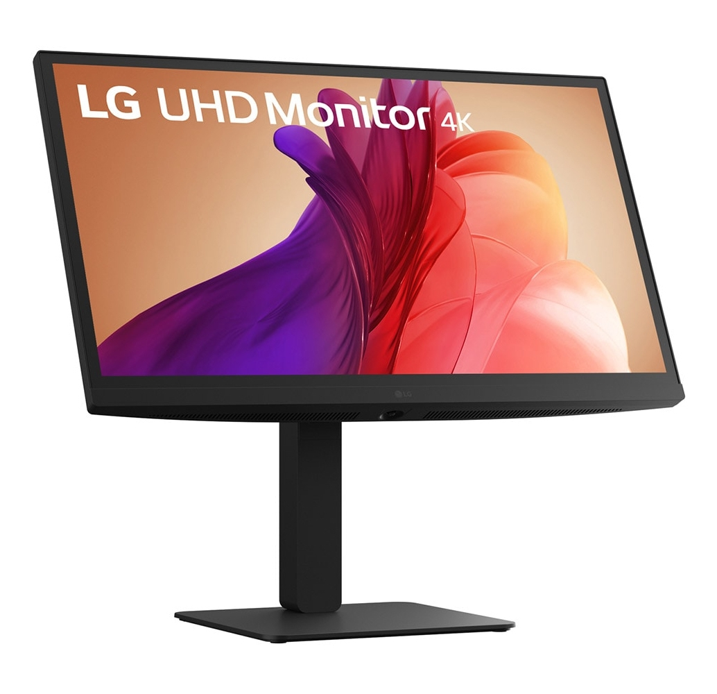 LG UHD 4K monitor. Display shows abstract art of purple and red shapes on a tan background. Black stand and base.