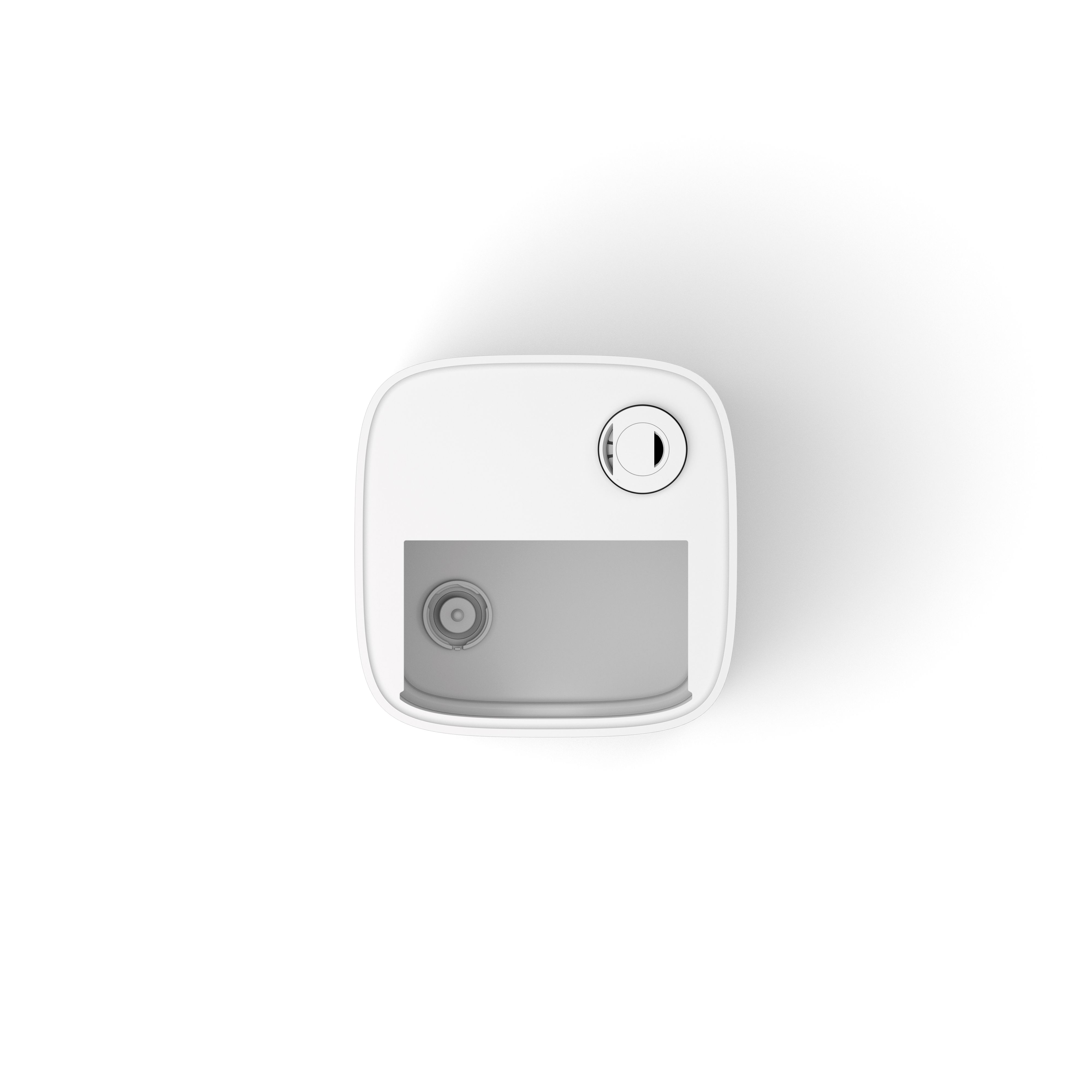 Top-down view of a white container with a rounded shape, a black and white lid, and a grey recessed area.