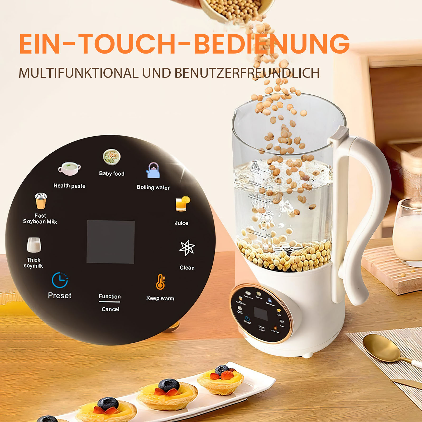 Ein weißer Sojamilchbereiter mit einem schwarzen Bedienfeld. Sojabohnen werden in den Glasbehälter gegossen. Im Vordergrund befinden sich Gebäckstücke.