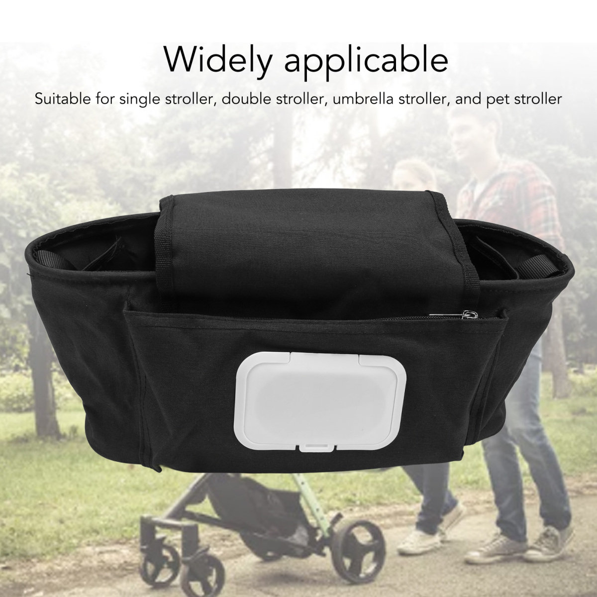 Schwarzer Kinderwagen-Organizer mit weißem Feuchttuchbehälter. Der Hintergrund zeigt einen Kinderwagen und Personen, die gehen.