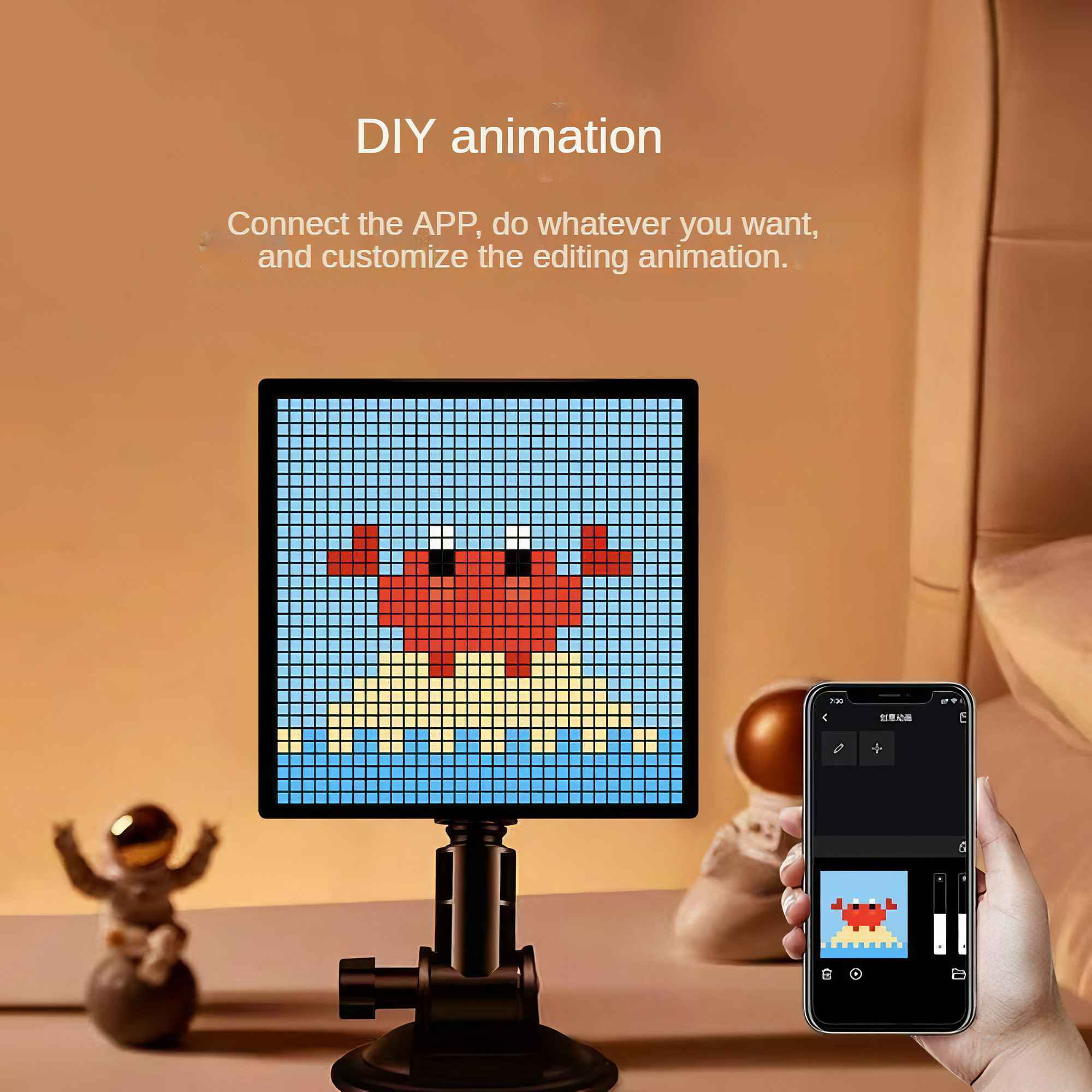 Ein Display zeigt eine pixelige Krabbe. Ein Telefon zeigt dasselbe Bild. Text lautet: 'DIY-Animation'.