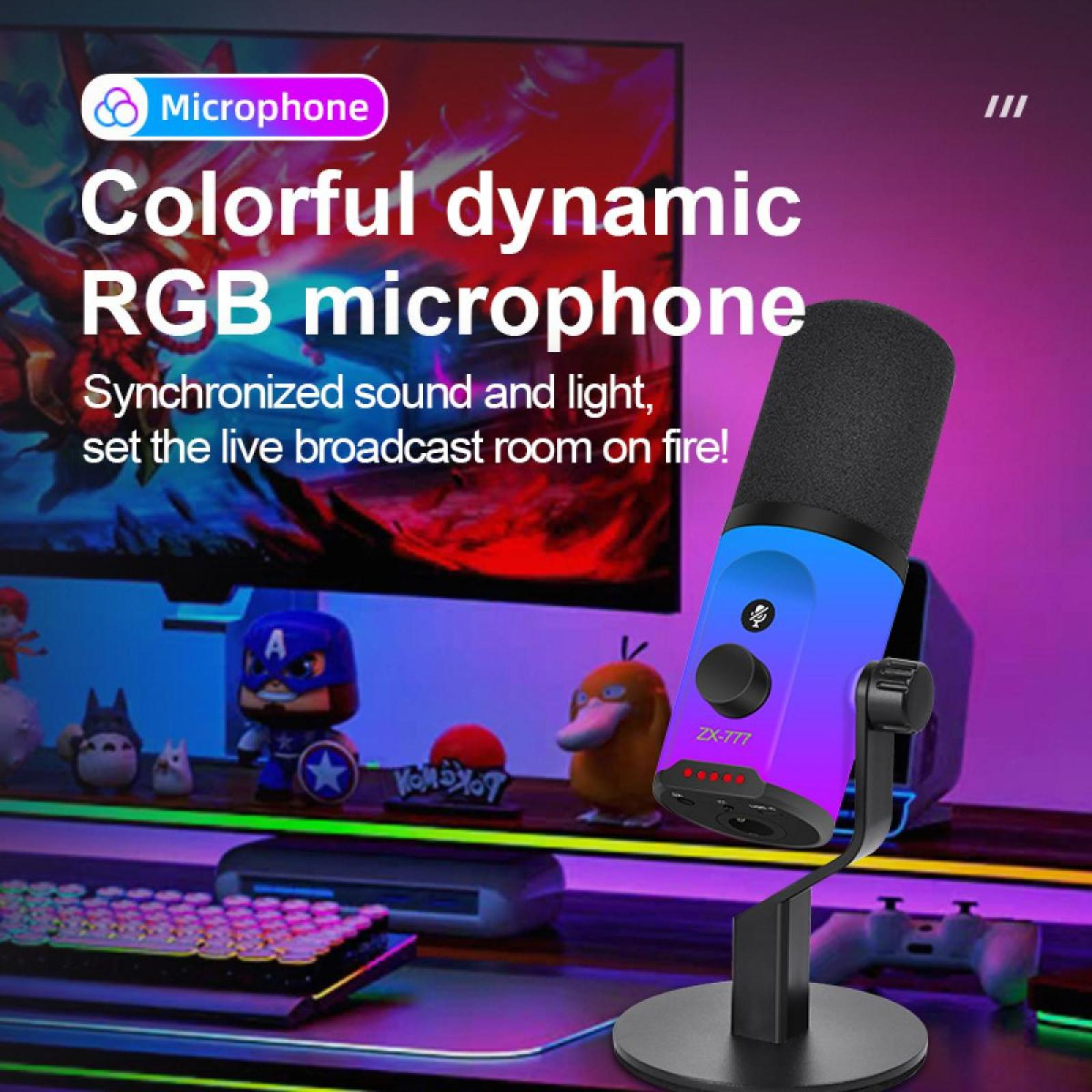 Ein farbenfrohes dynamisches RGB-Mikrofon steht vor einem Gaming-Setup. Im Hintergrund sind ein Bildschirm und Spielzeug zu sehen.