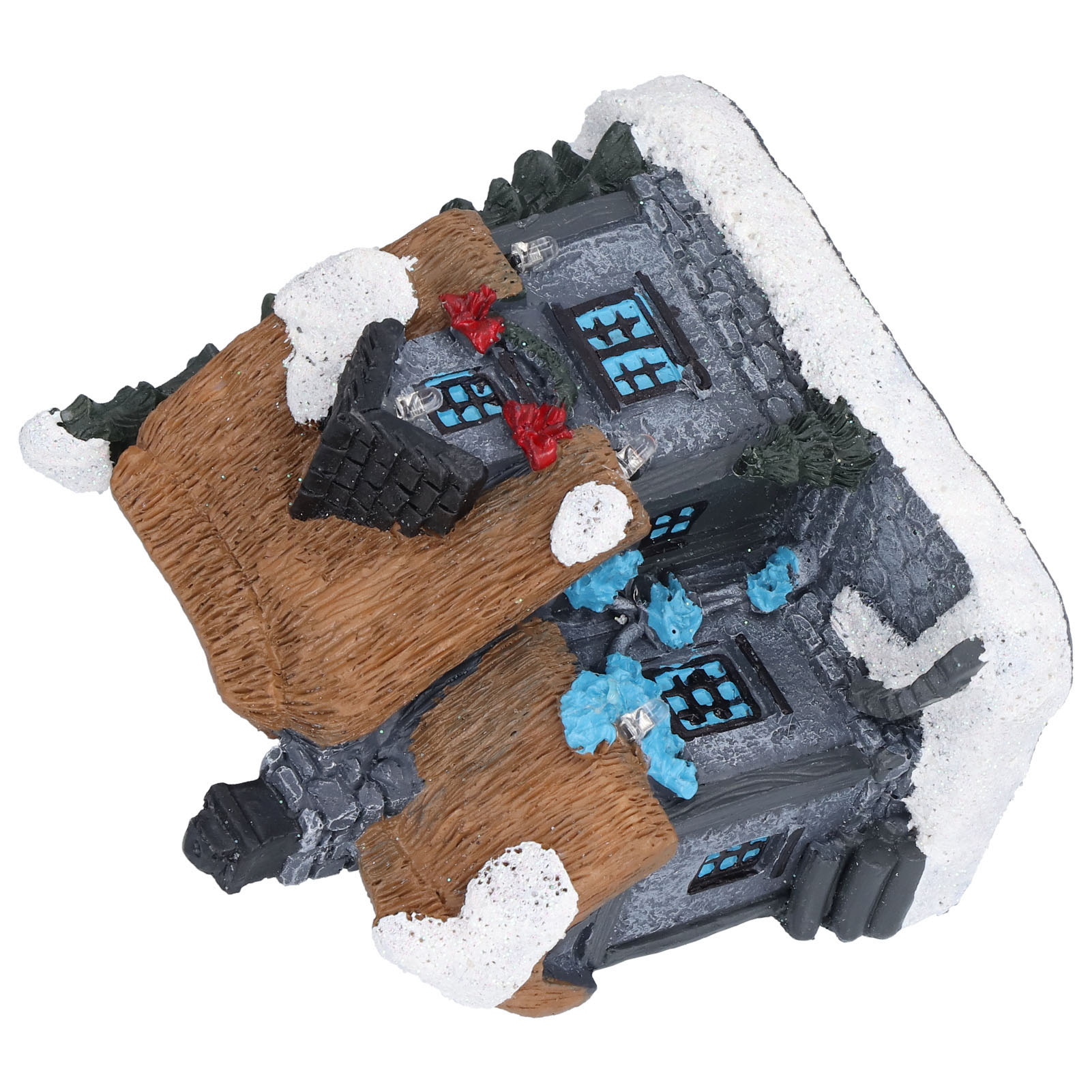 Miniaturhaus mit schneebedecktem Dach und braunem Strohdach. Die Fenster sind blau mit silbernen Akzenten. Rote Dekorationen sind vorhanden.