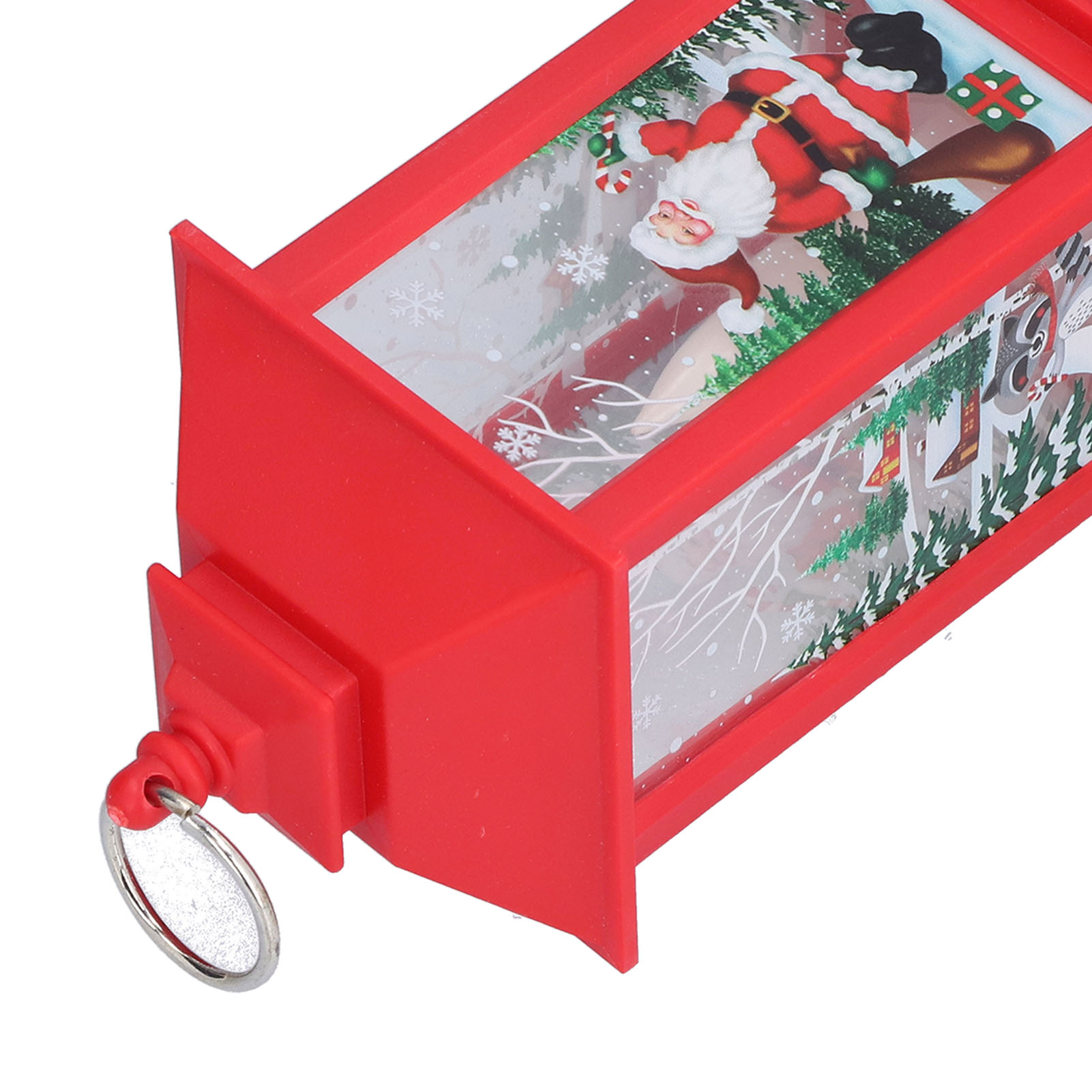 Ein rotes, rechteckiges Weihnachtsdekor mit Weihnachtsmann darin. Es hat einen Schlüsselanhänger und eine Winterszene.