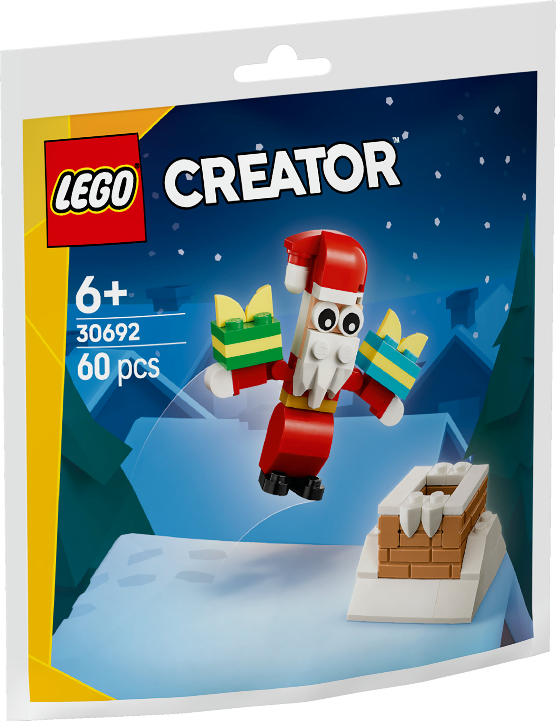 Figurka LEGO Creator Świętego Mikołaja z prezentami i kominem na śnieżnym tle. Widoczne opakowanie.