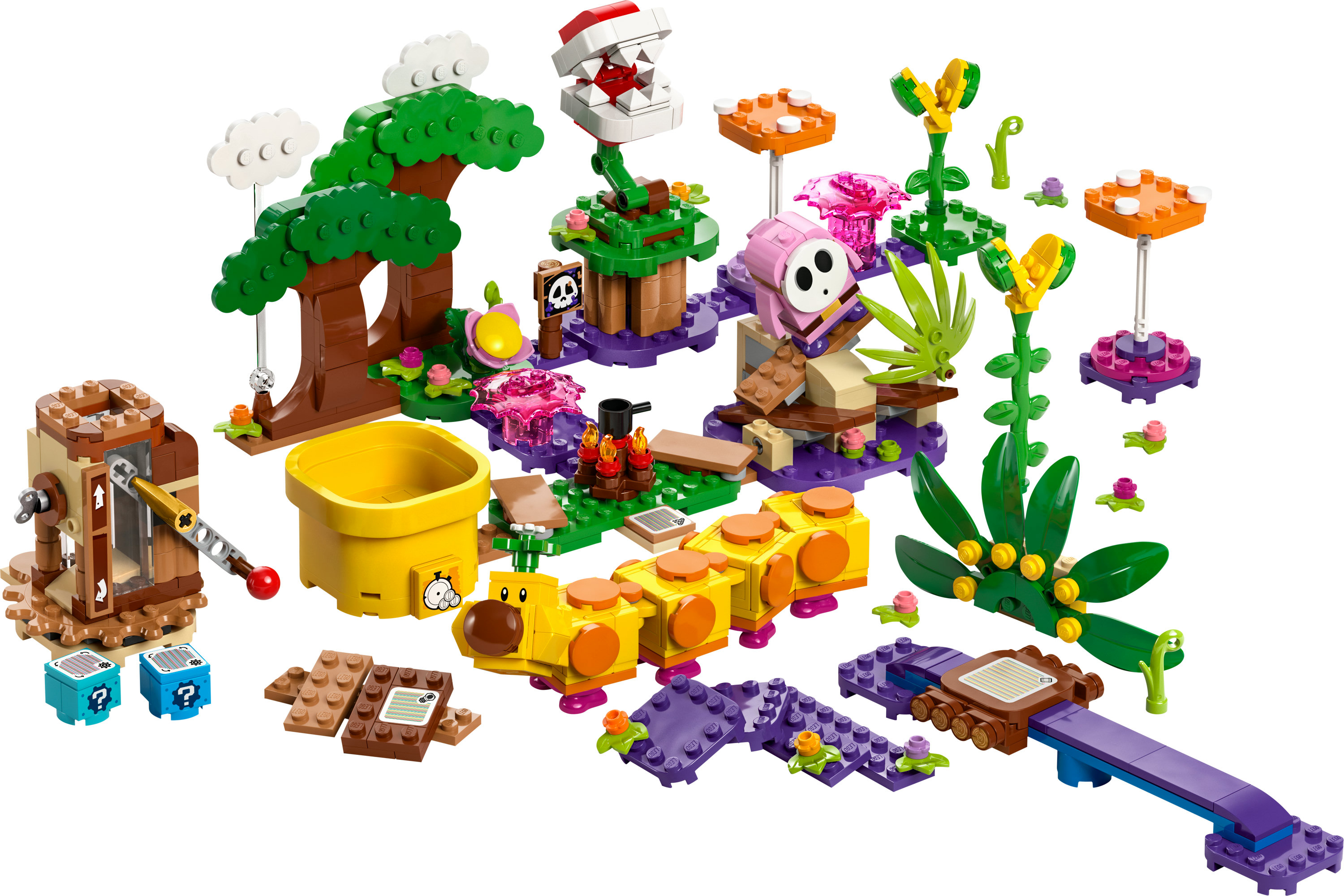 Ensemble Lego avec divers personnages et objets, dont une Plante Piranha, Shy Guy et une chenille jaune.