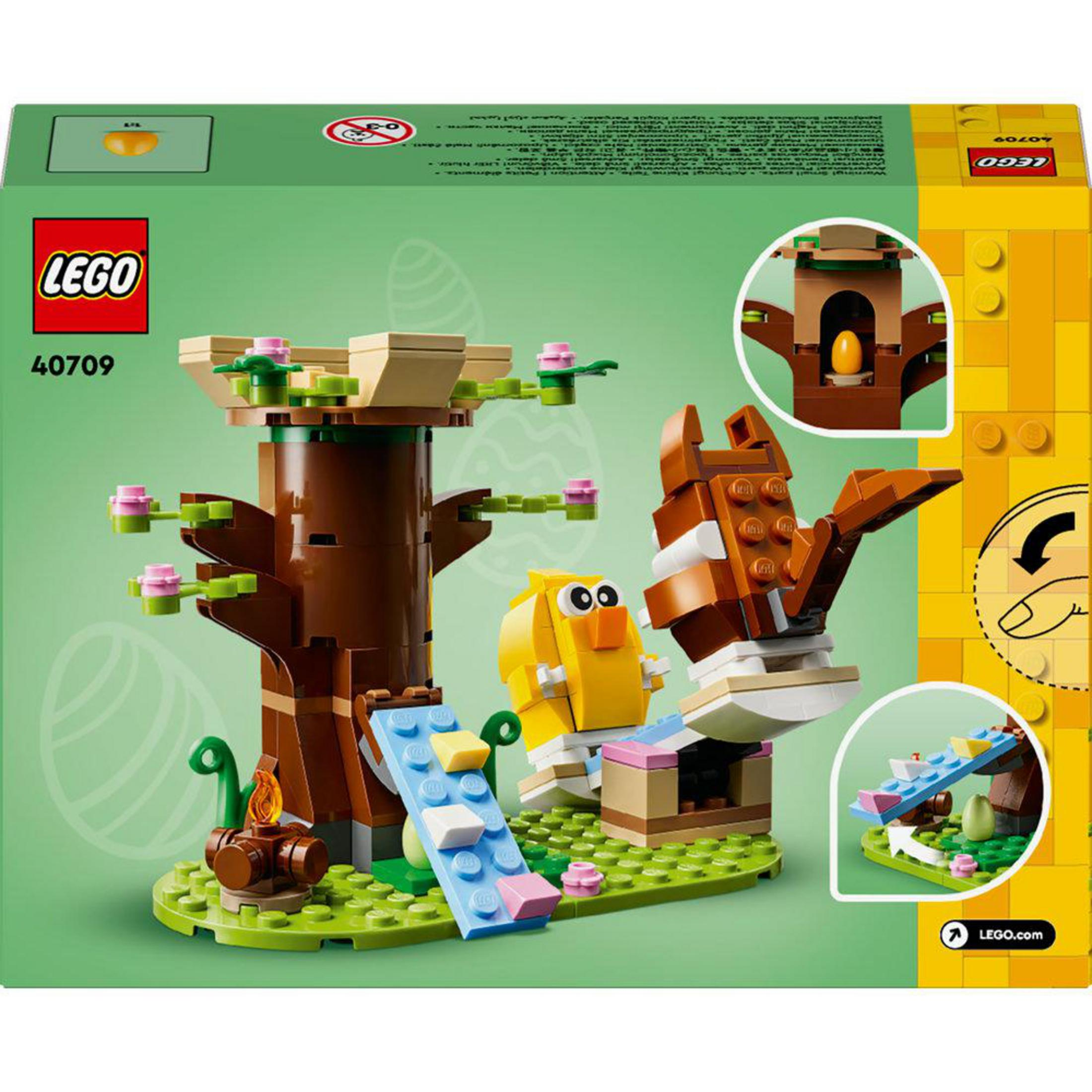 LEGO seti 40709, ağaç, sarı civciv, kahverengi tavşan ve yeşil zemin üzerinde kamp ateşi, yeşil arka plan.