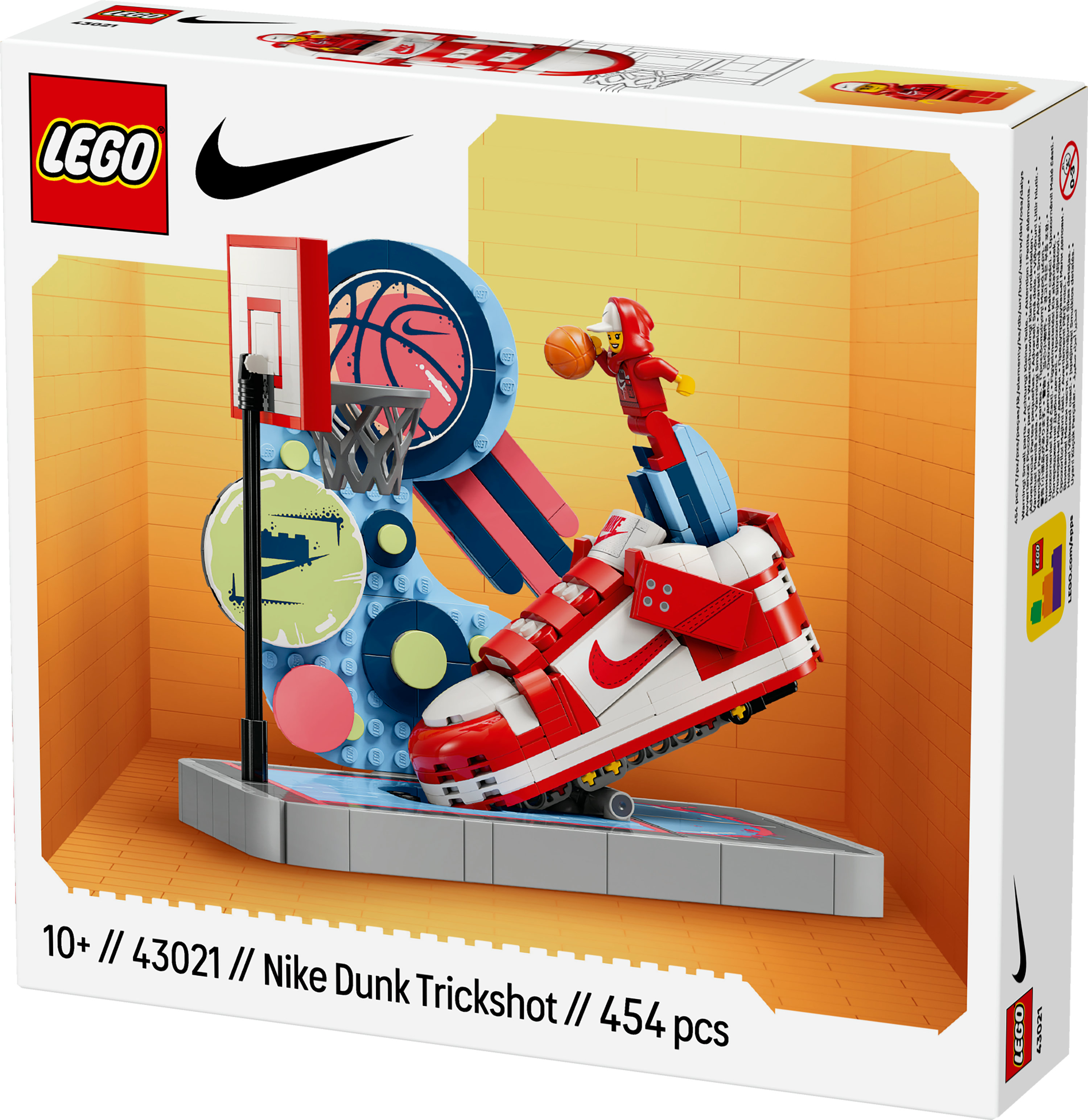 LEGO Nike Dunk Trickshot set kutusu. Kırmızı ve beyaz bir ayakkabı, bir basketbol potası ve bir minifigür gösteriyor.