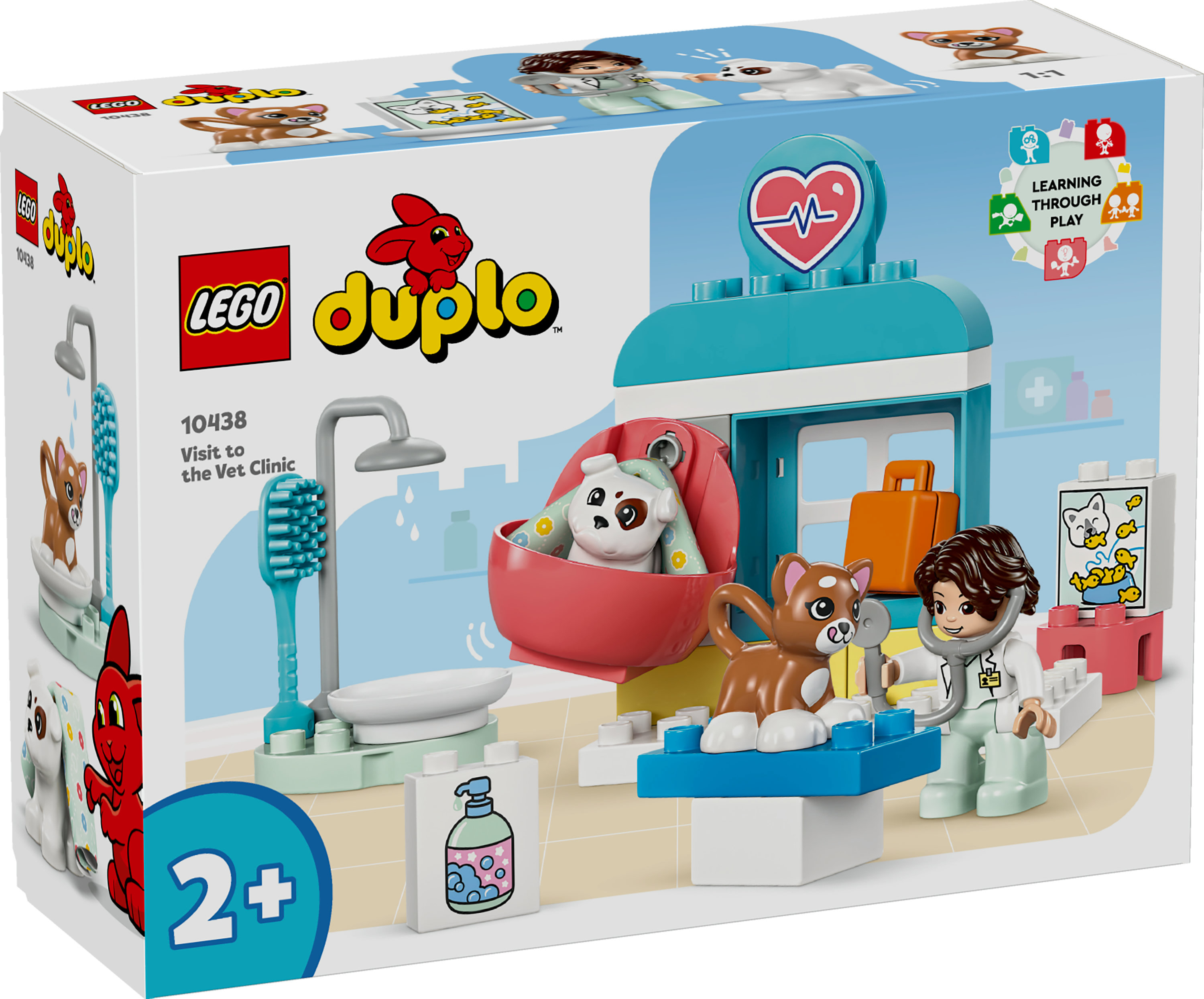 Lego Duplo dierenkliniek set. Het heeft een dierenarts, kat, hond en accessoires. De doos toont een dierenkliniek scene.
