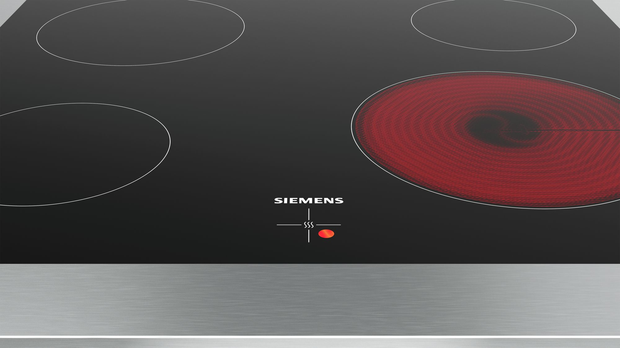 Une table de cuisson à induction Siemens noire avec quatre brûleurs. Un brûleur est rouge. La surface est noire avec des accents argentés.