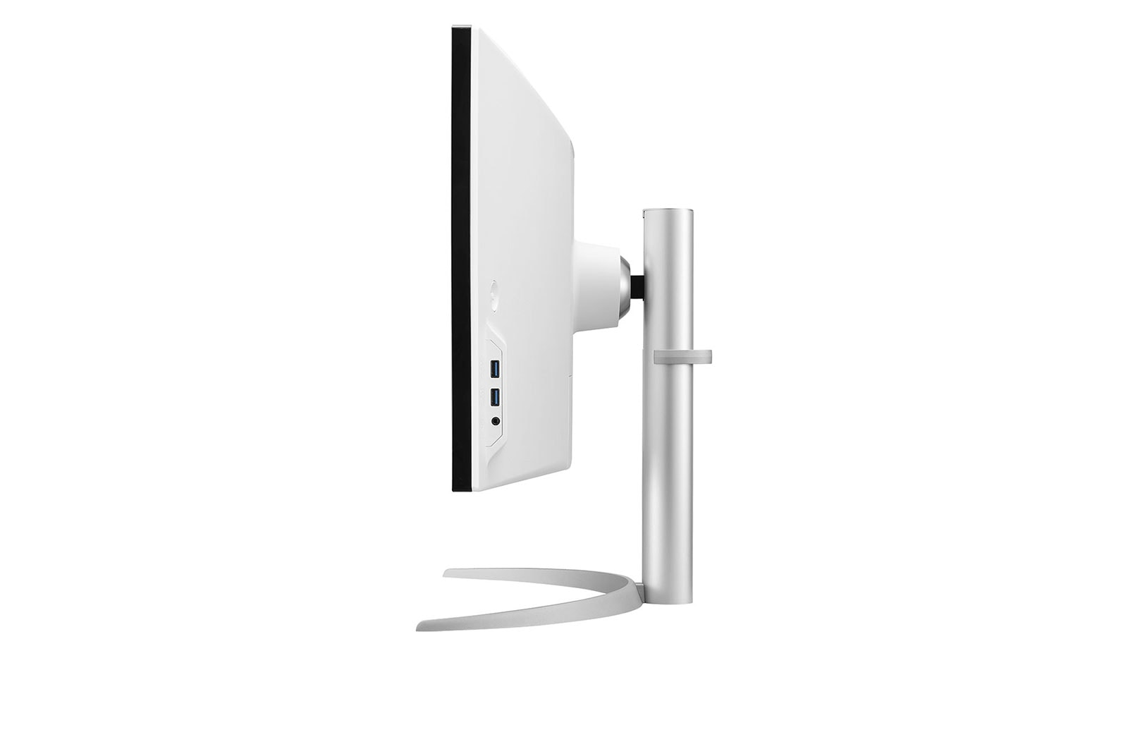 Widok z boku białego monitora komputera z czarną obwódką. Stoi na srebrnym stojaku. Ekran jest skierowany w lewo.