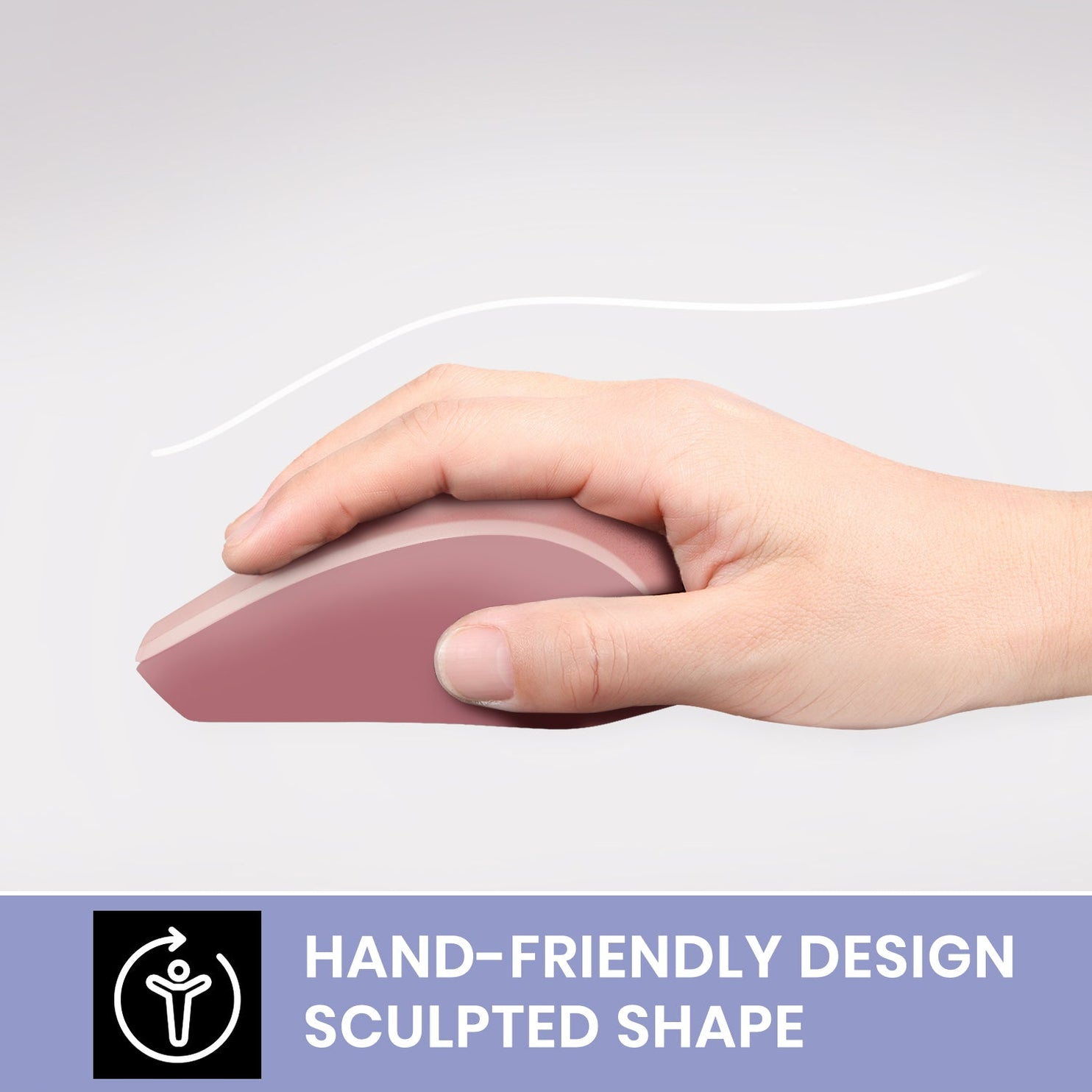 Ręka trzyma różową mysz. Biała linia łukowato nad nią. Tekst: Przyjazny dla dłoni design, kształt rzeźbiony.