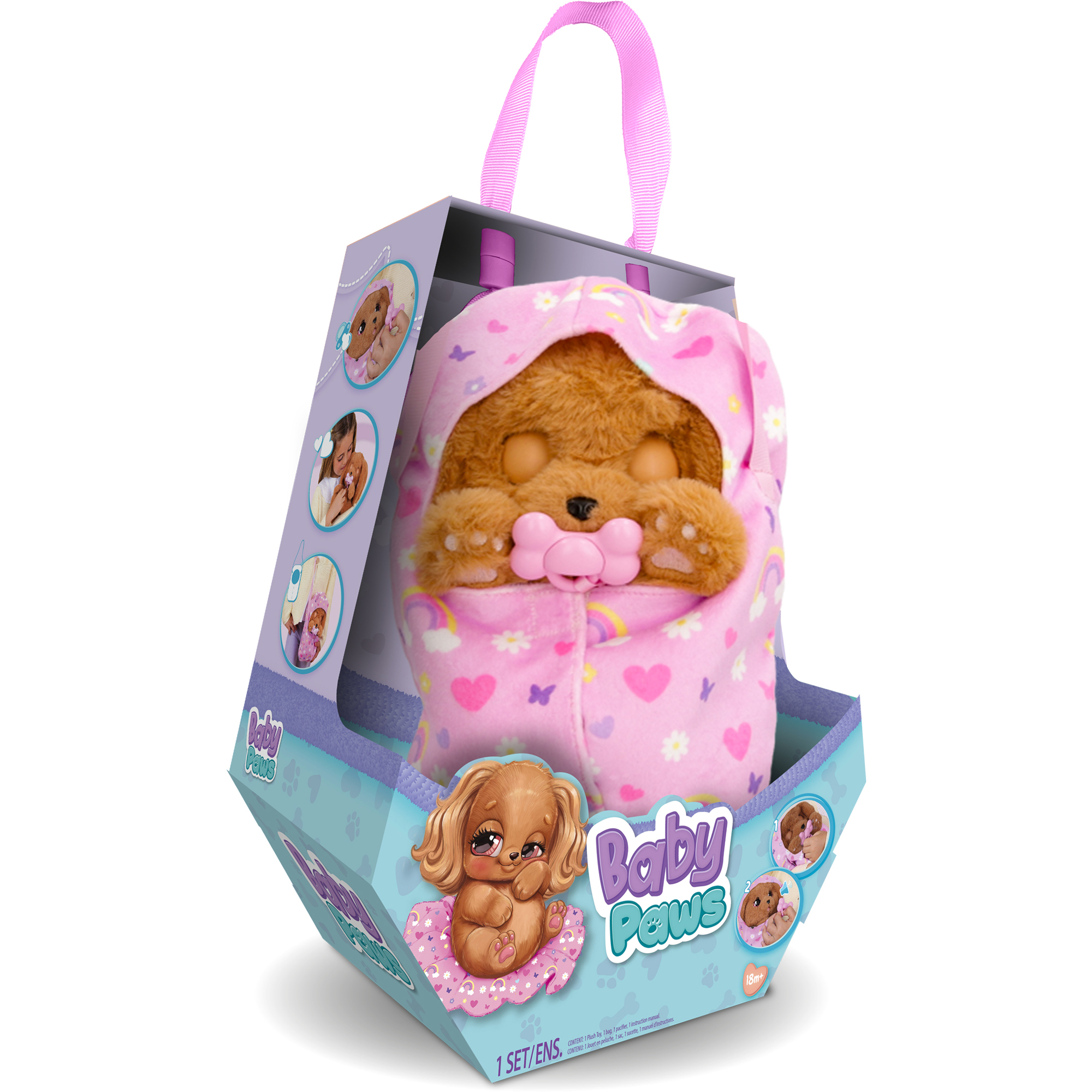 Un juguete Baby Paws en una caja. El peluche es un perro marrón con un traje rosa con capucha y un chupete.