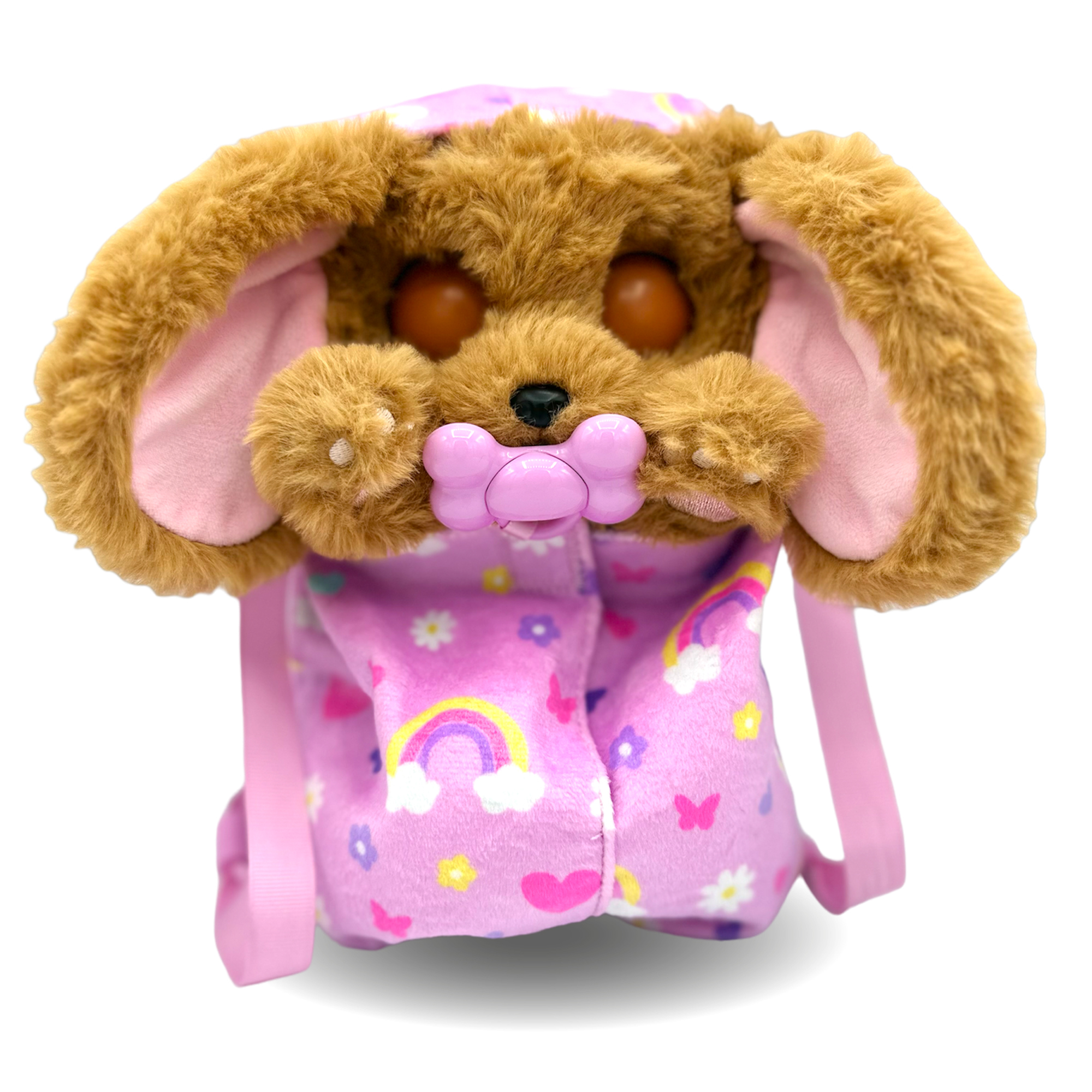 Un peluche de perro que lleva un traje rosa con arcoíris y flores. Tiene pelo marrón, orejas rosas y un chupete en la boca.