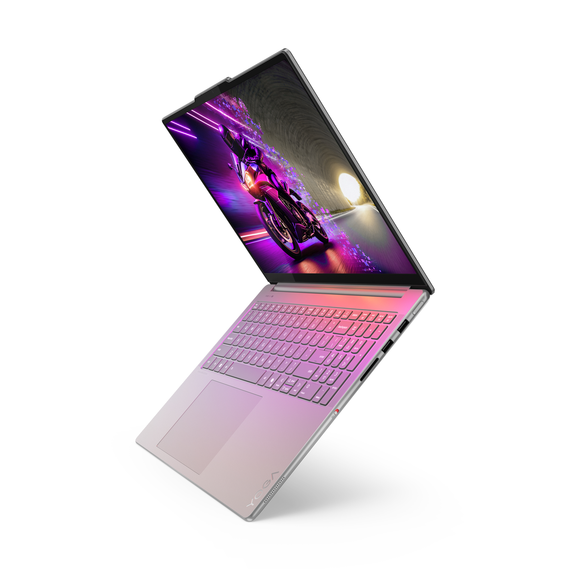 Laptop mit Bildschirm, der ein Motorrad zeigt, das durch einen Tunnel rast. Die Tastatur ist sichtbar, mit einem Rosa- und Silberverlauf.
