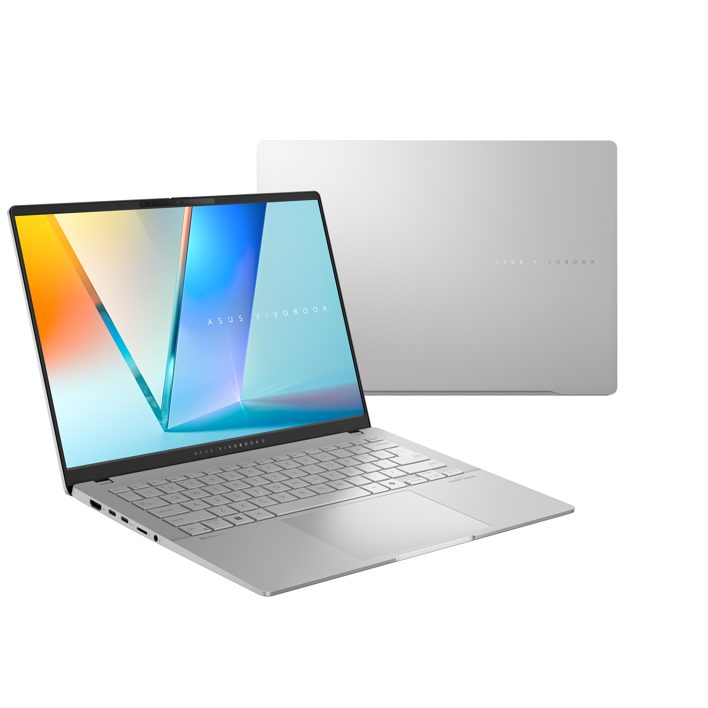Un laptop ASUS Vivobook argentato è aperto, mostrando la tastiera e lo schermo. Un secondo laptop è dietro.