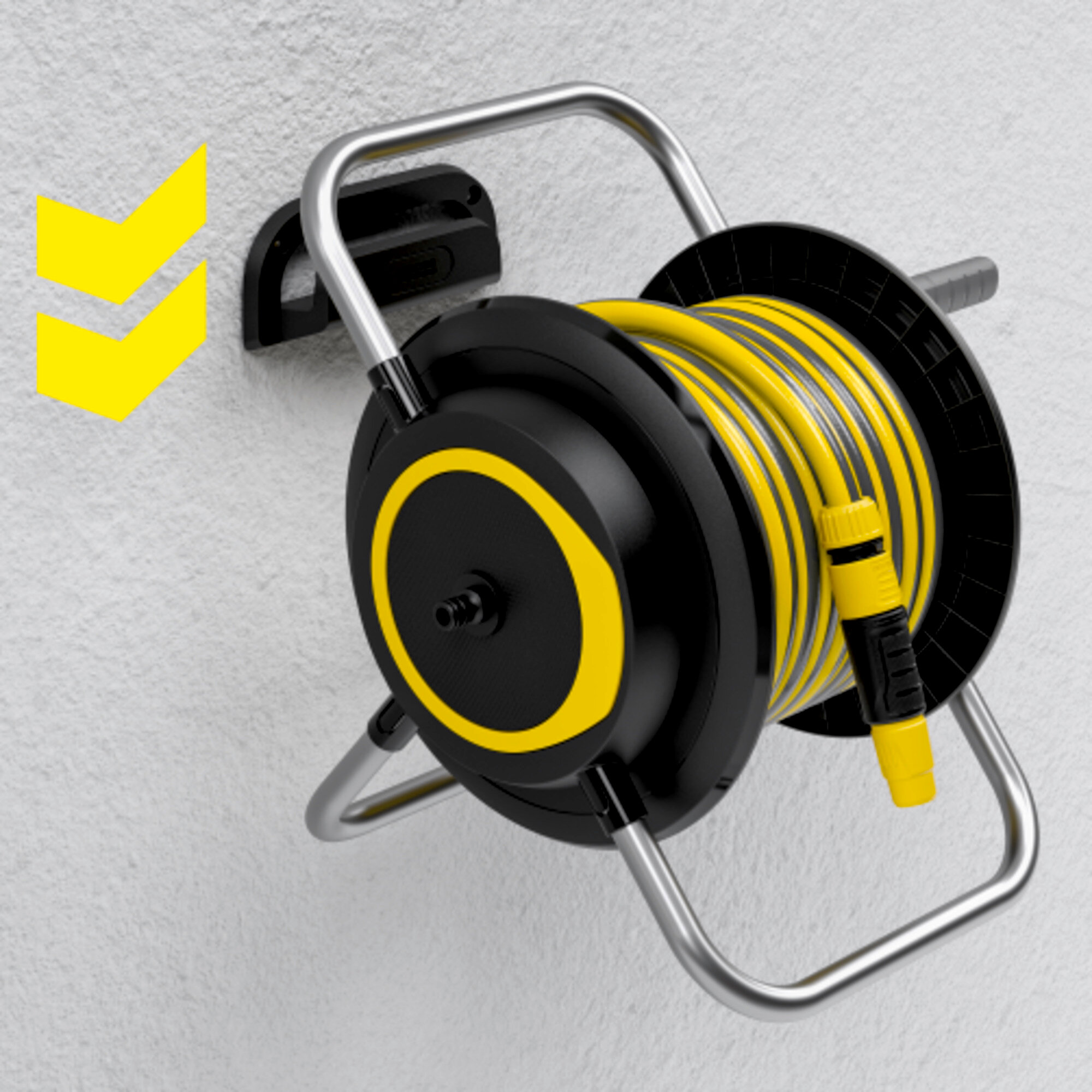 Czarny i żółty bęben na wąż zamontowany na białej ścianie. Żółty wąż jest zwinięty w środku. Żółta strzałka na ścianie.