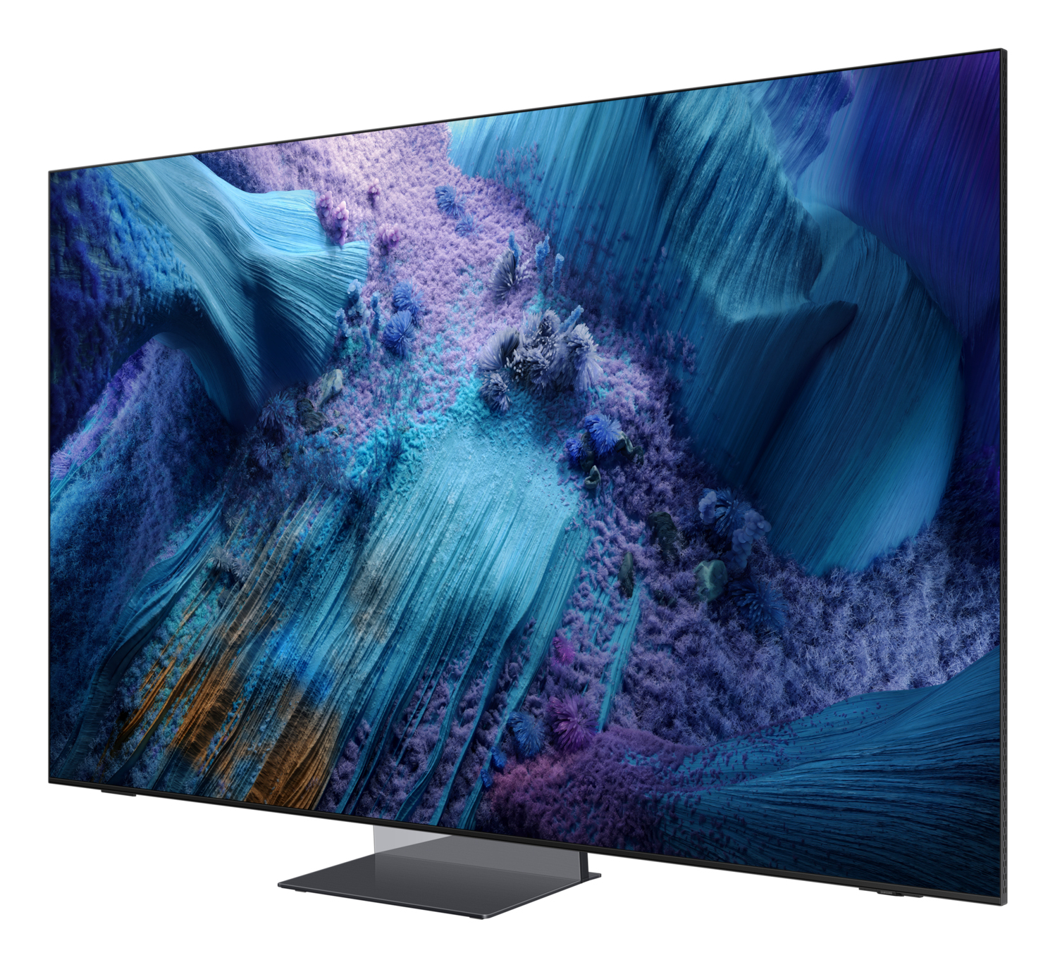 Nowoczesny telewizor wyświetlający abstrakcyjny krajobraz w odcieniach niebieskiego i fioletowego. Telewizor stoi na stojaku, lekko pochylony.