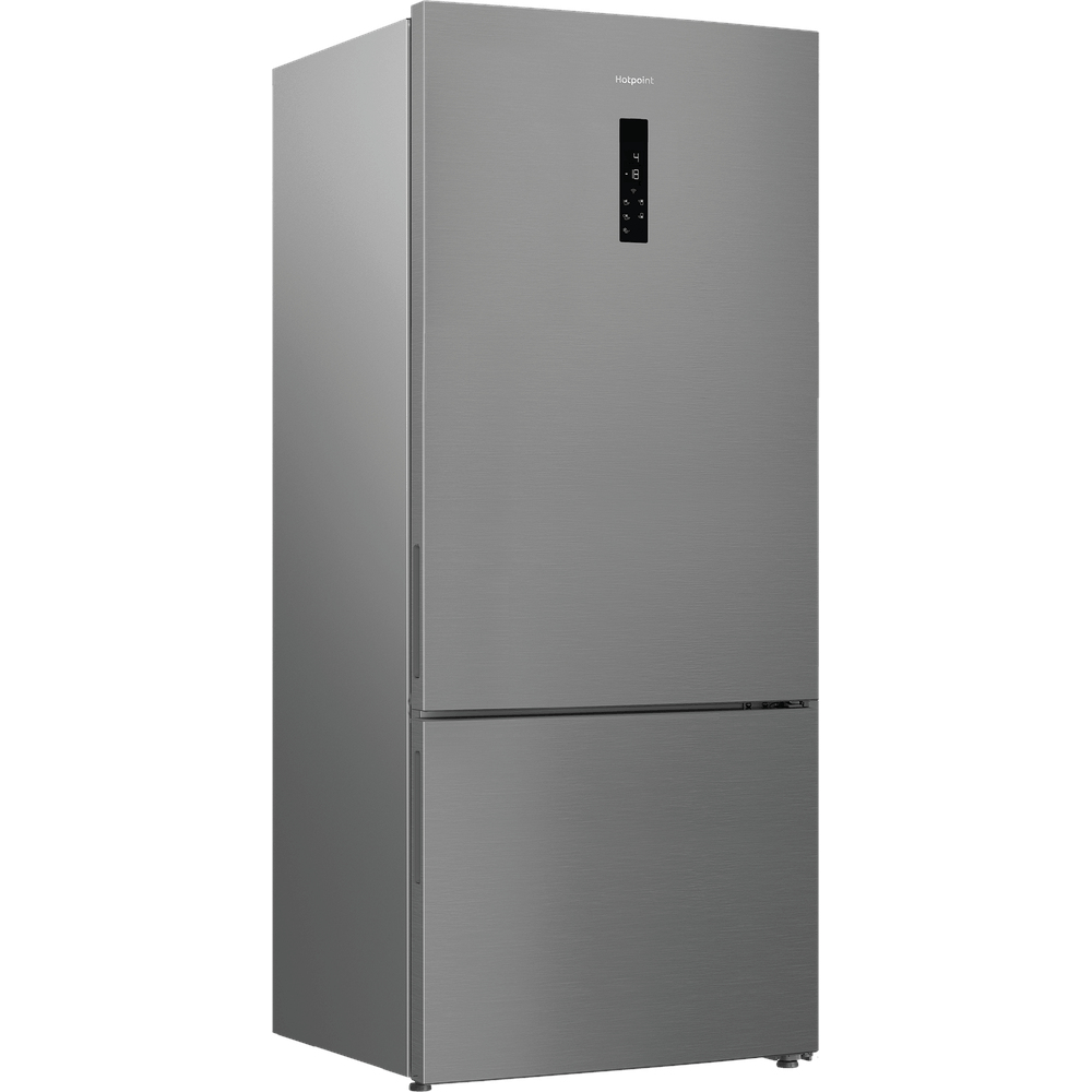 Un frigorifero Hotpoint argento è in piedi. Ha una porta superiore e un cassetto inferiore. Il pannello di controllo è sulla porta superiore.