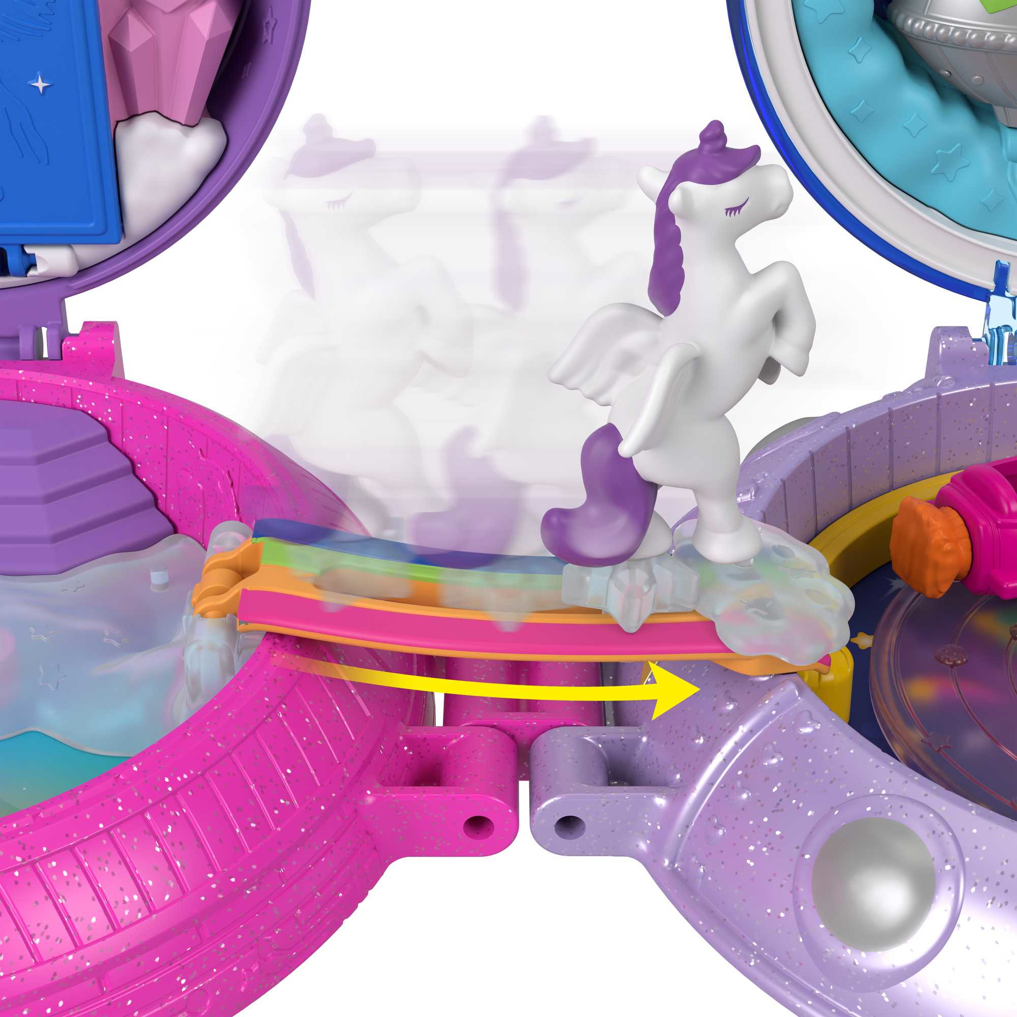 Ein Spielset mit einem weißen Einhorn auf einer Regenbogenbrücke, umgeben von rosa und lila Strukturen und einem gelben Pfeil.