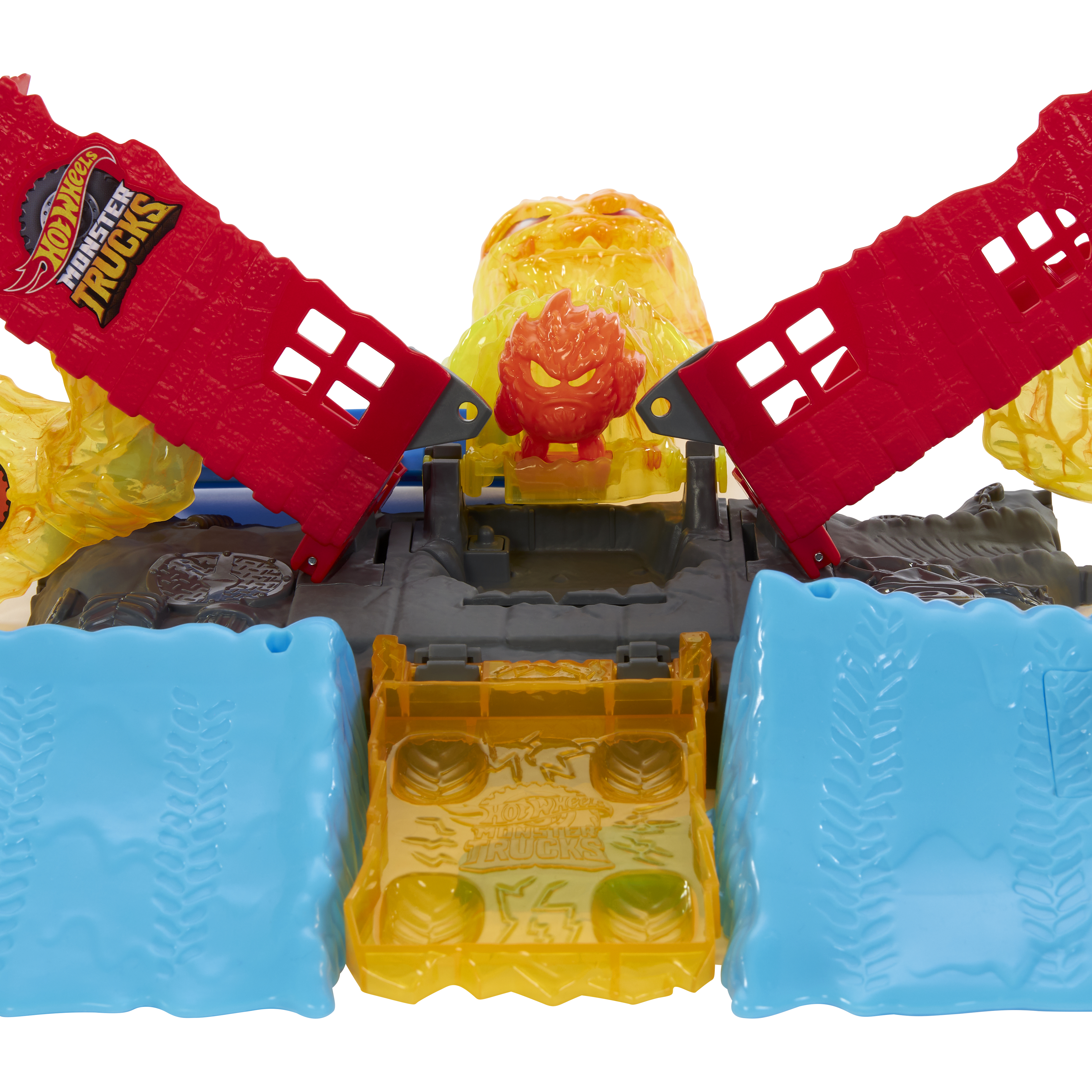 Ein Hot Wheels Monster Trucks Spielset. Es enthält rote Rampen, blaue und gelbe Barrieren und eine Monstertruck-Figur.