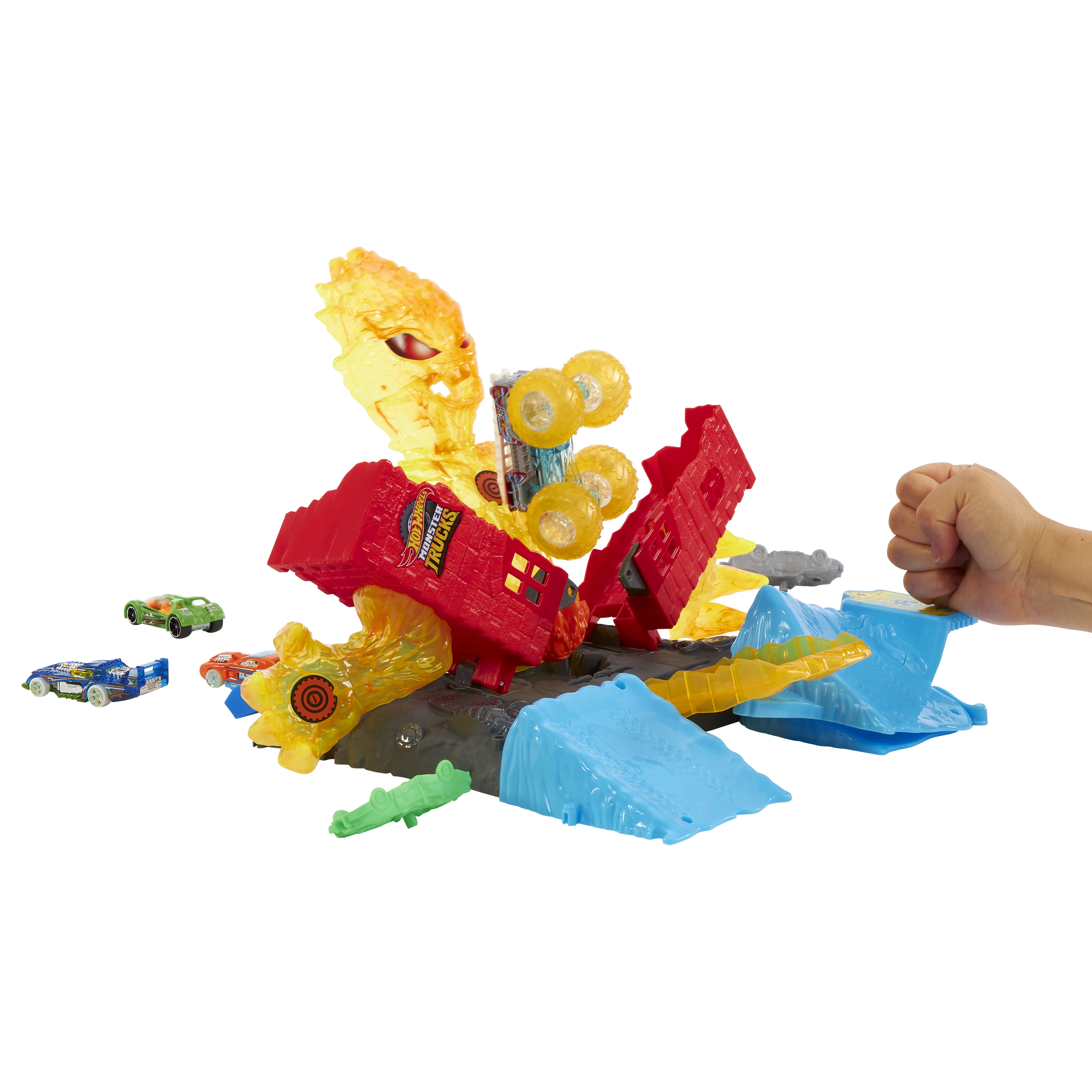Ein Spielzeug-Monstertruck-Set. Enthält Monstertruck, Autos und eine Strecke mit Hindernissen und einer Hand.