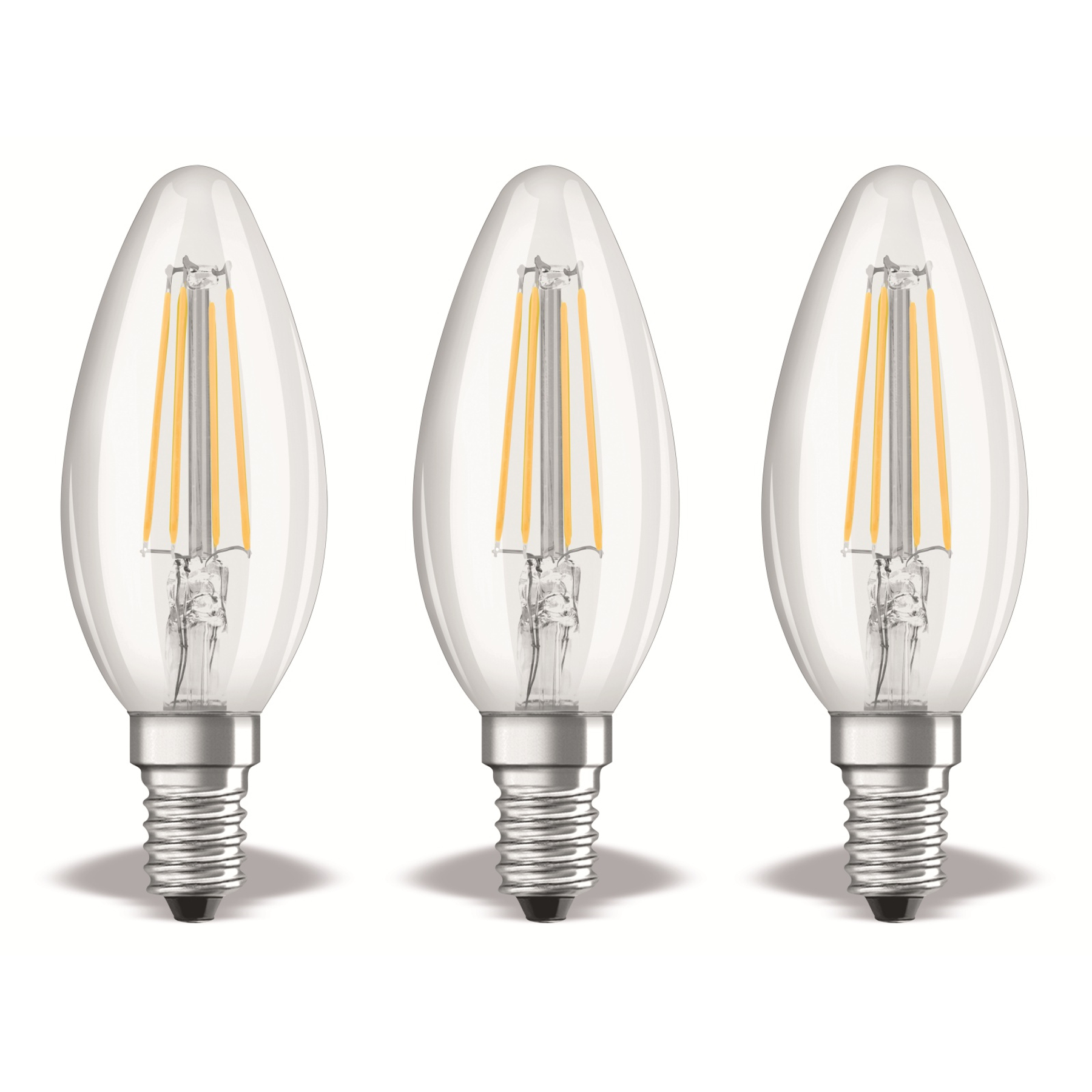 Tre lampadine trasparenti, ovali, con filamenti gialli su sfondo bianco. Ognuna ha una base argentata.