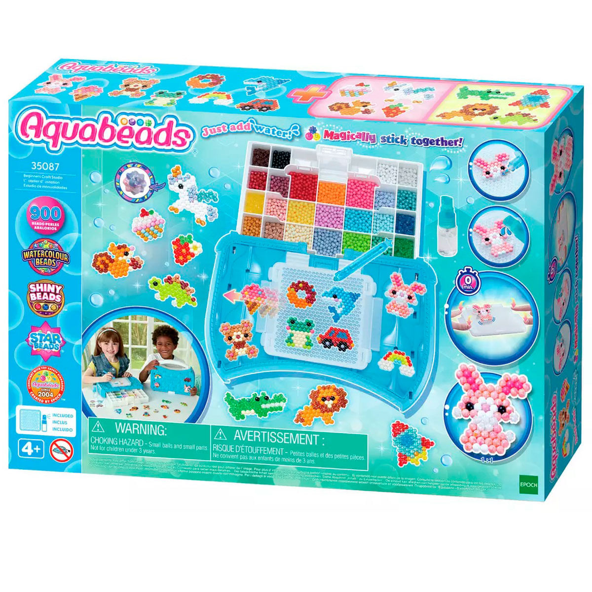 Caja del kit de manualidades Aquabeads. Tiene cuentas de colores, imágenes de niños y una advertencia. La caja tiene ilustraciones.