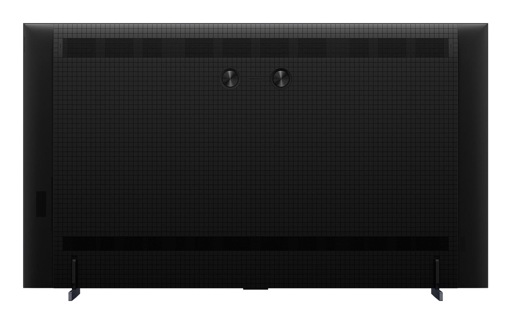 Tył czarnego telewizora. Ma teksturowaną powierzchnię. Dwa okrągłe porty znajdują się na środku. Dwie nogi podtrzymują dół.
