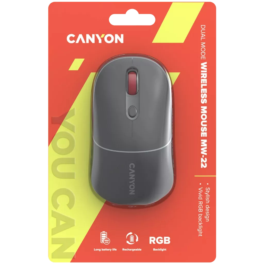 Une souris sans fil Canyon grise dans son emballage rouge et jaune. Caractéristiques : Design élégant, rétroéclairage RVB, longue durée de vie de la batterie et rechargeable.