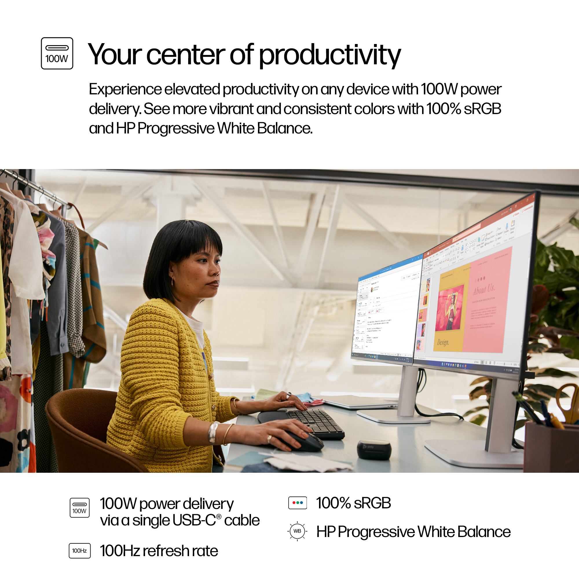 Woman at a desk with dual monitors. She wears a yellow sweater and uses a keyboard. The monitors show documents.