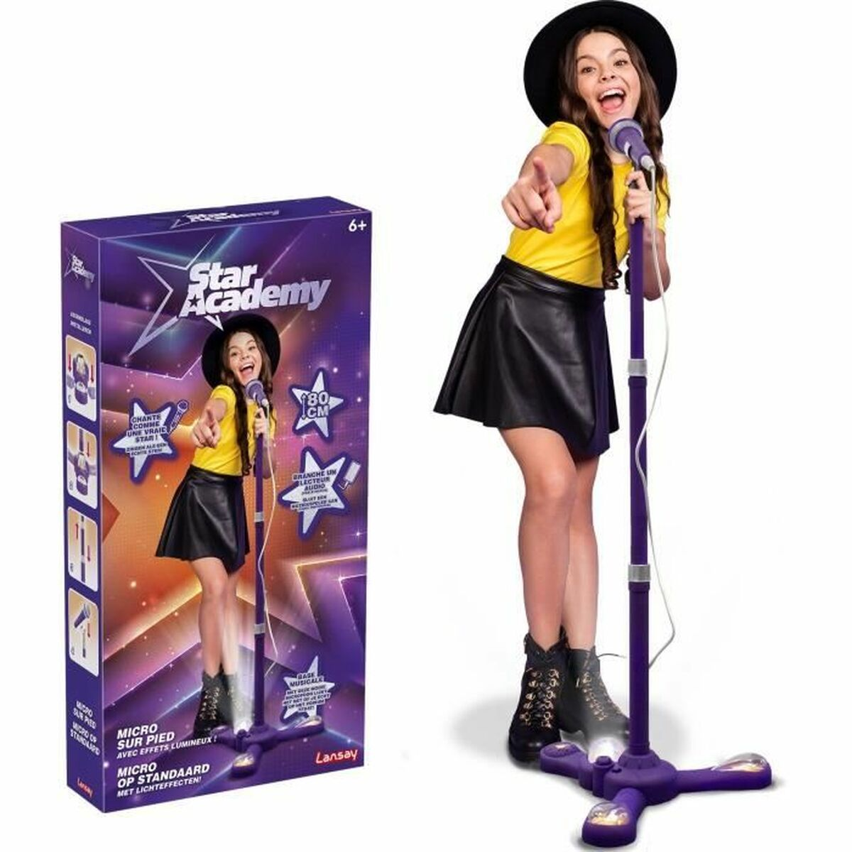 Dziewczyna w czarnym kapeluszu i spódnicy śpiewa do fioletowego mikrofonu. Pudełko przedstawia tę samą dziewczynę z mikrofonem.