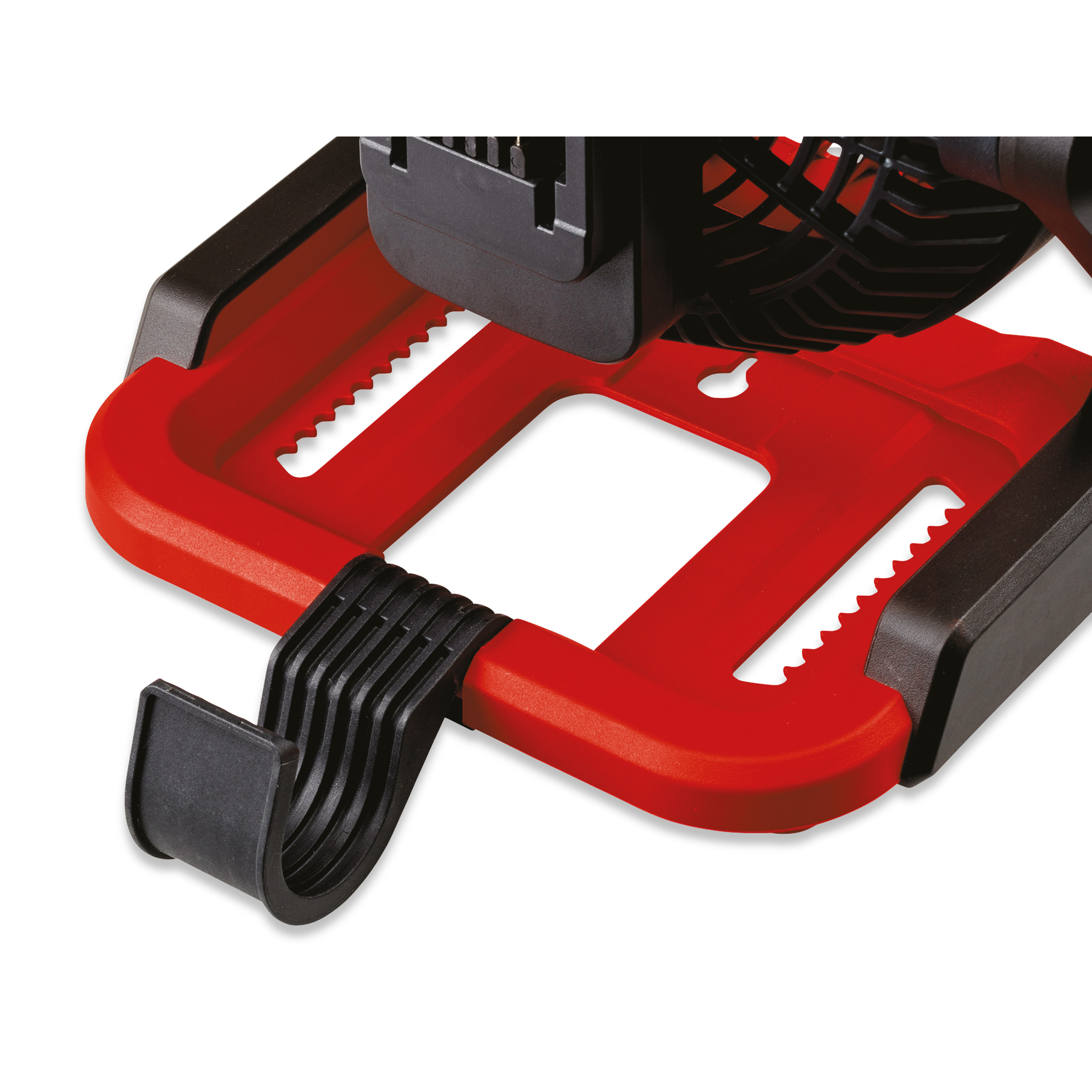 Czerwono-czarny plastikowy przedmiot z hakiem, strukturą przypominającą wentylator i ząbkowaną krawędzią.