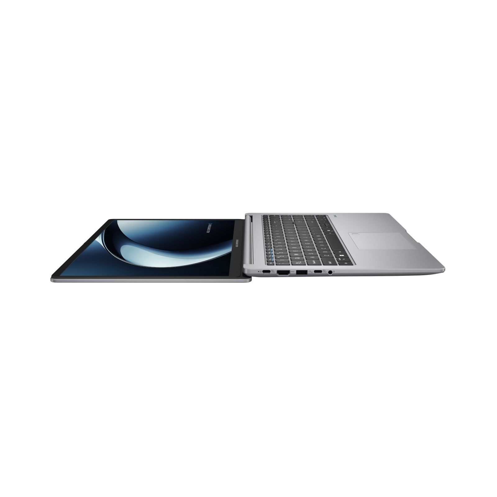 Un laptop argentato è aperto, con lo schermo che mostra un design astratto blu e bianco. La tastiera è visibile.