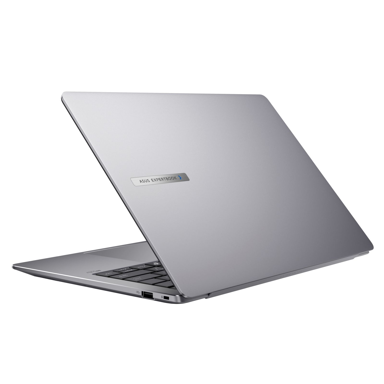 Szary laptop, częściowo otwarty, jest pochylony. Widoczne logo ASUS EXPERTBOOK. Tło jest białe, z widoczną klawiaturą.
