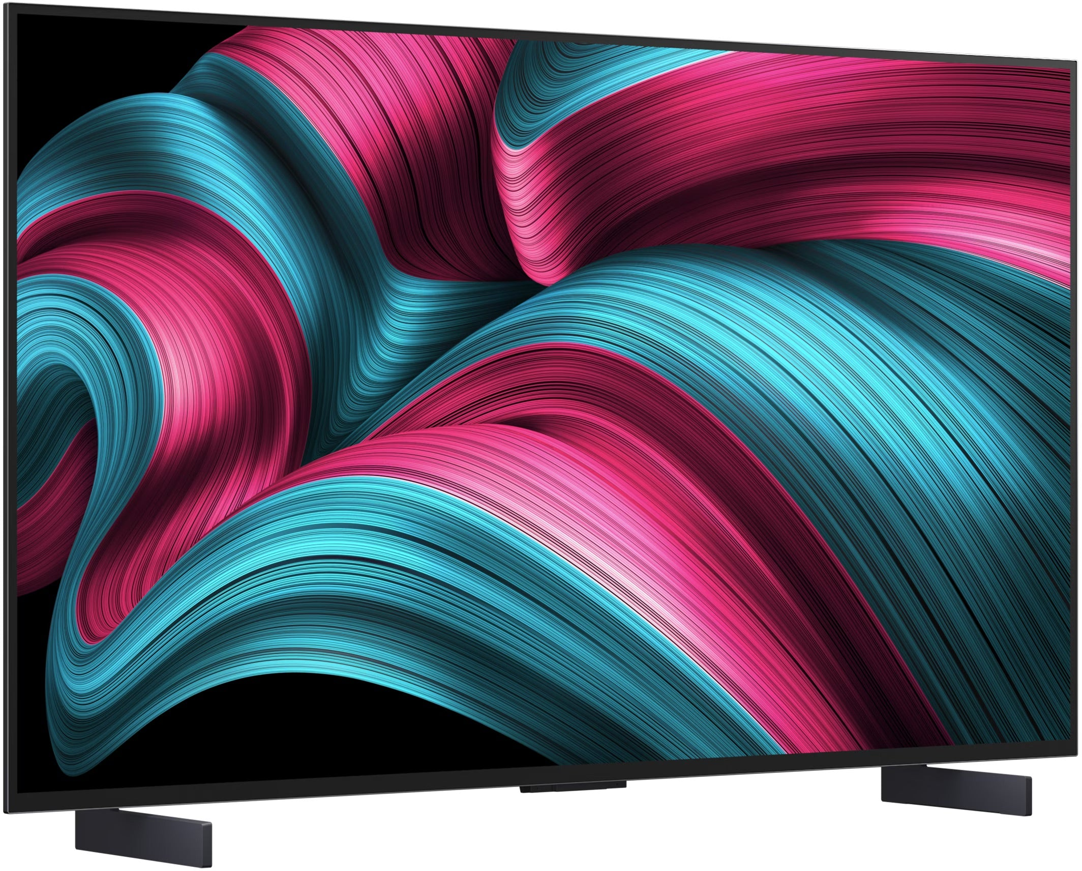 Una grande TV mostra un motivo astratto colorato di linee fluenti verde acqua e rosa su sfondo nero. Ha gambe nere.