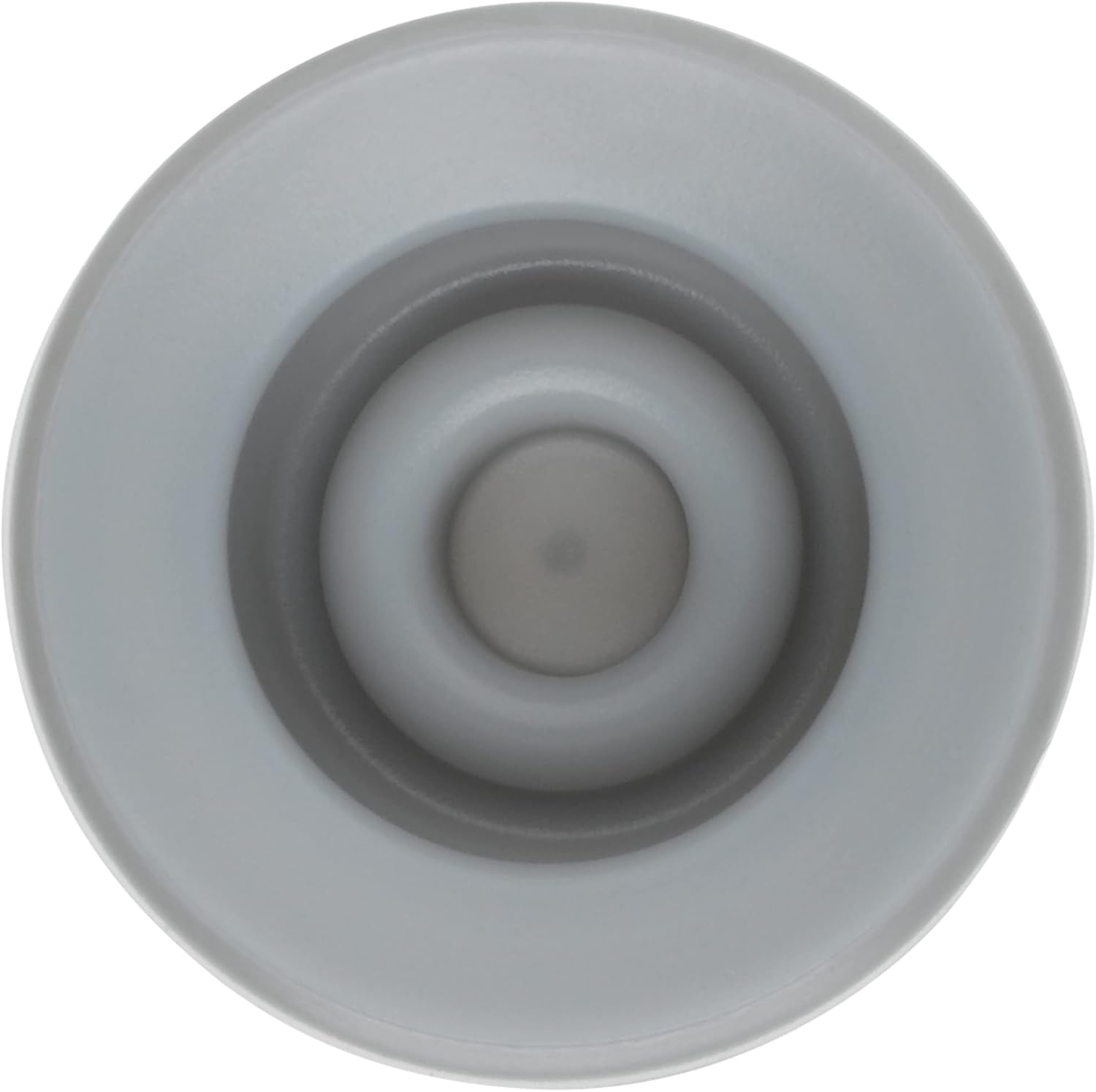 Vista superior de un objeto circular gris con anillos concéntricos. El objeto tiene un círculo central gris oscuro.