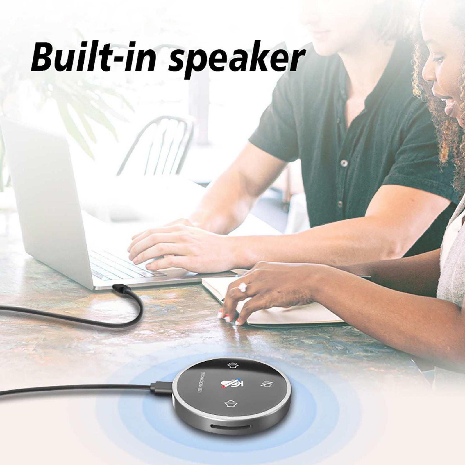 Zwei Personen an einem Tisch mit Laptop und Lautsprecher. Der Text „Built-in speaker“ wird angezeigt.