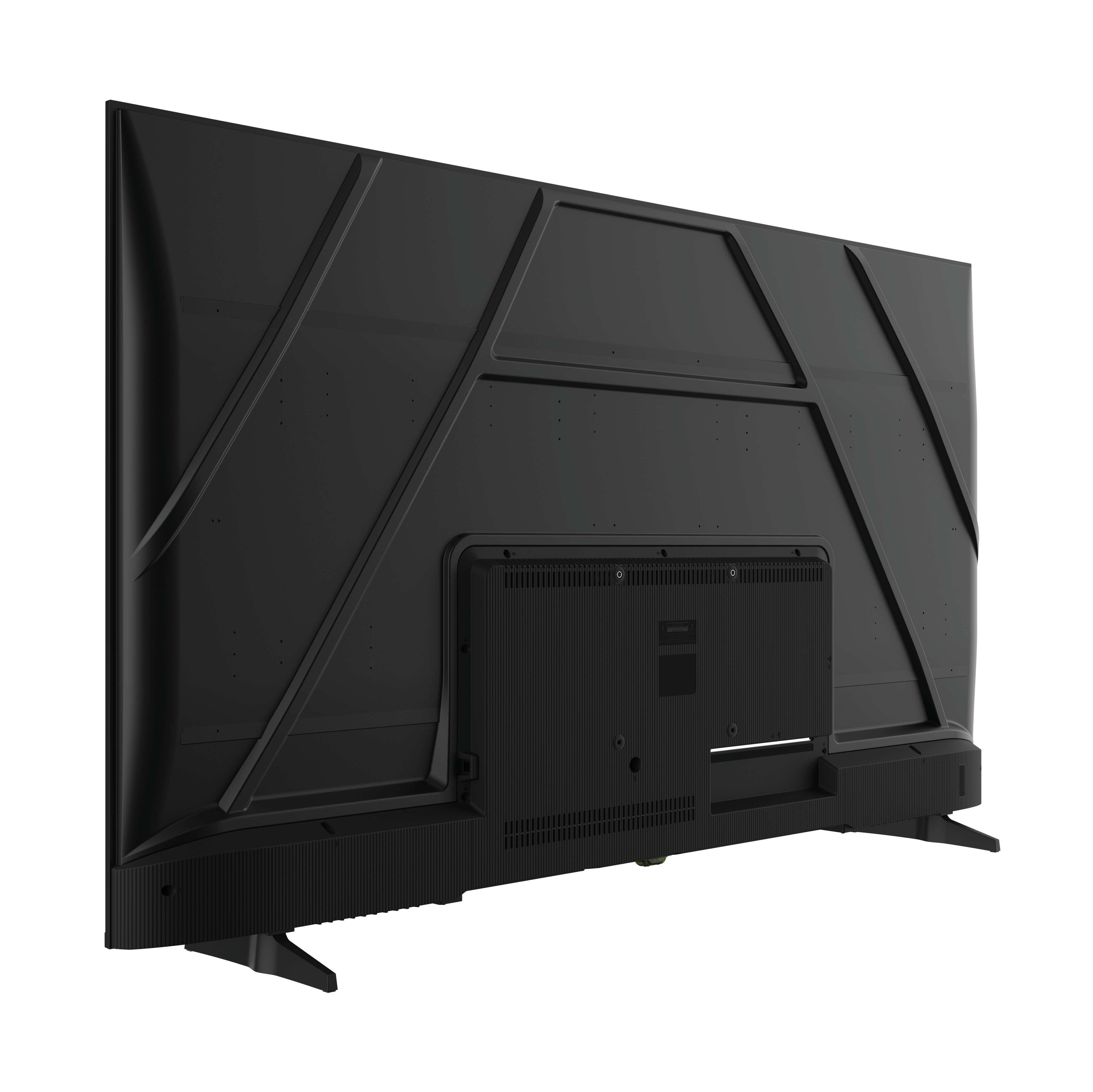 Parte trasera de un televisor negro. Son visibles el panel trasero con ventilaciones, puertos y soportes. El televisor está sobre un fondo blanco.