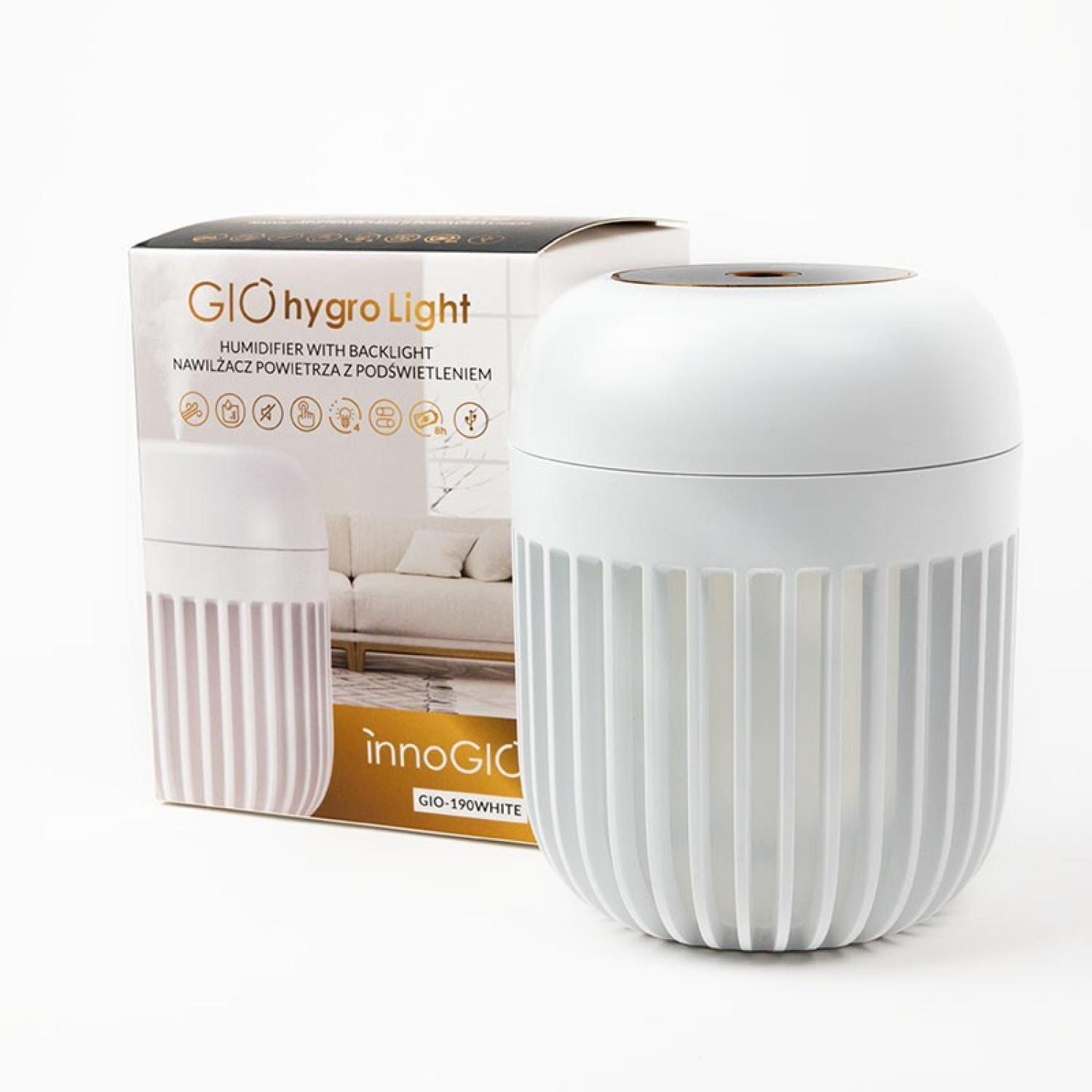 Un humidificador blanco con una caja. La caja dice "GIO hygro Light" con detalles del producto. El humidificador tiene un cuerpo blanco y un diseño acanalado.