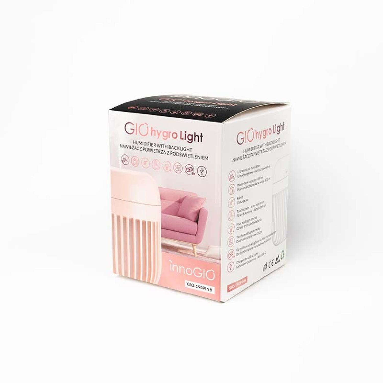 Una caja rosa y blanca del humidificador GIO hygro Light. La caja tiene una foto del producto y un sofá rosa.
