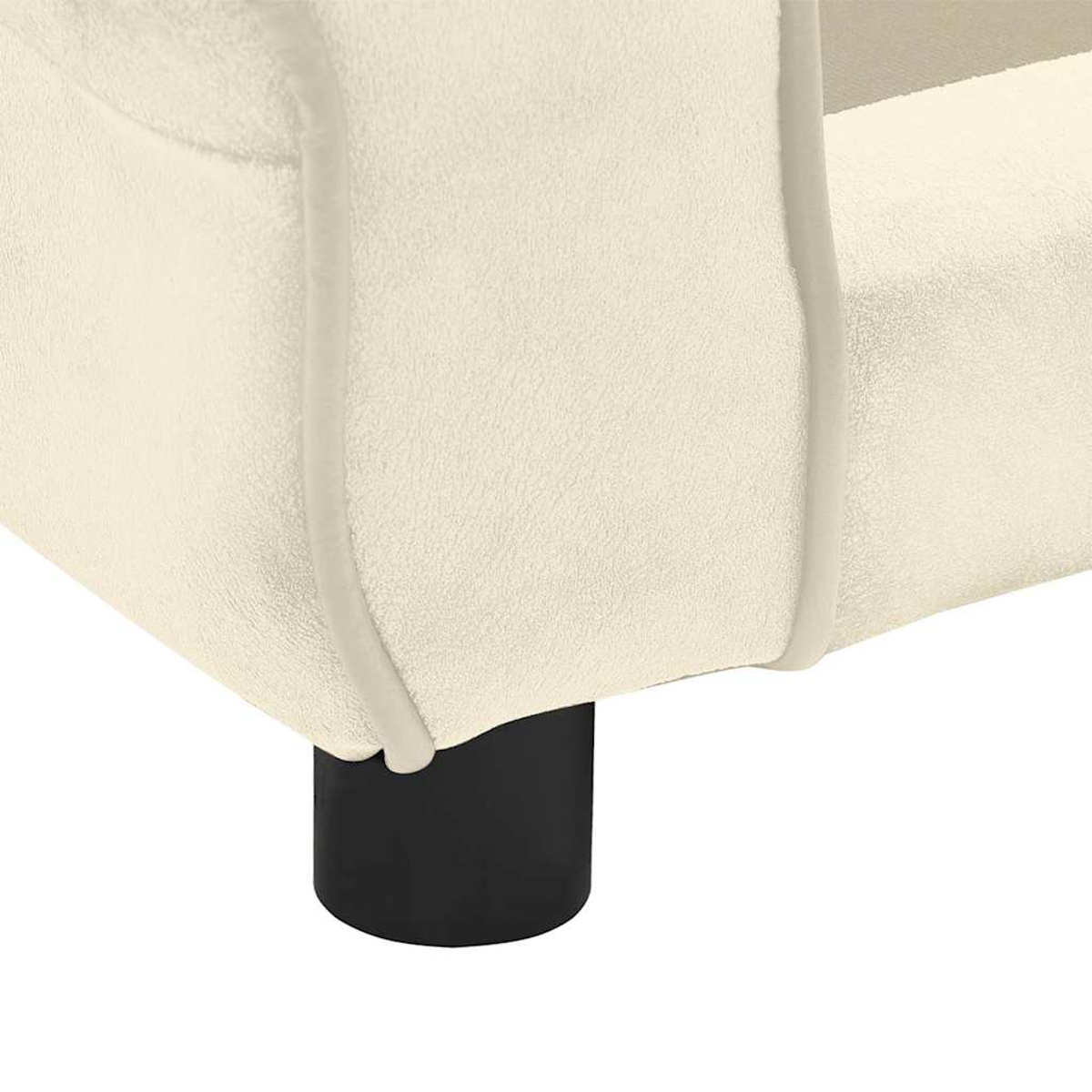 Nahaufnahme eines cremefarbenen Sofas mit abgerundeter Kante und einem schwarzen zylindrischen Bein auf weißem Hintergrund.