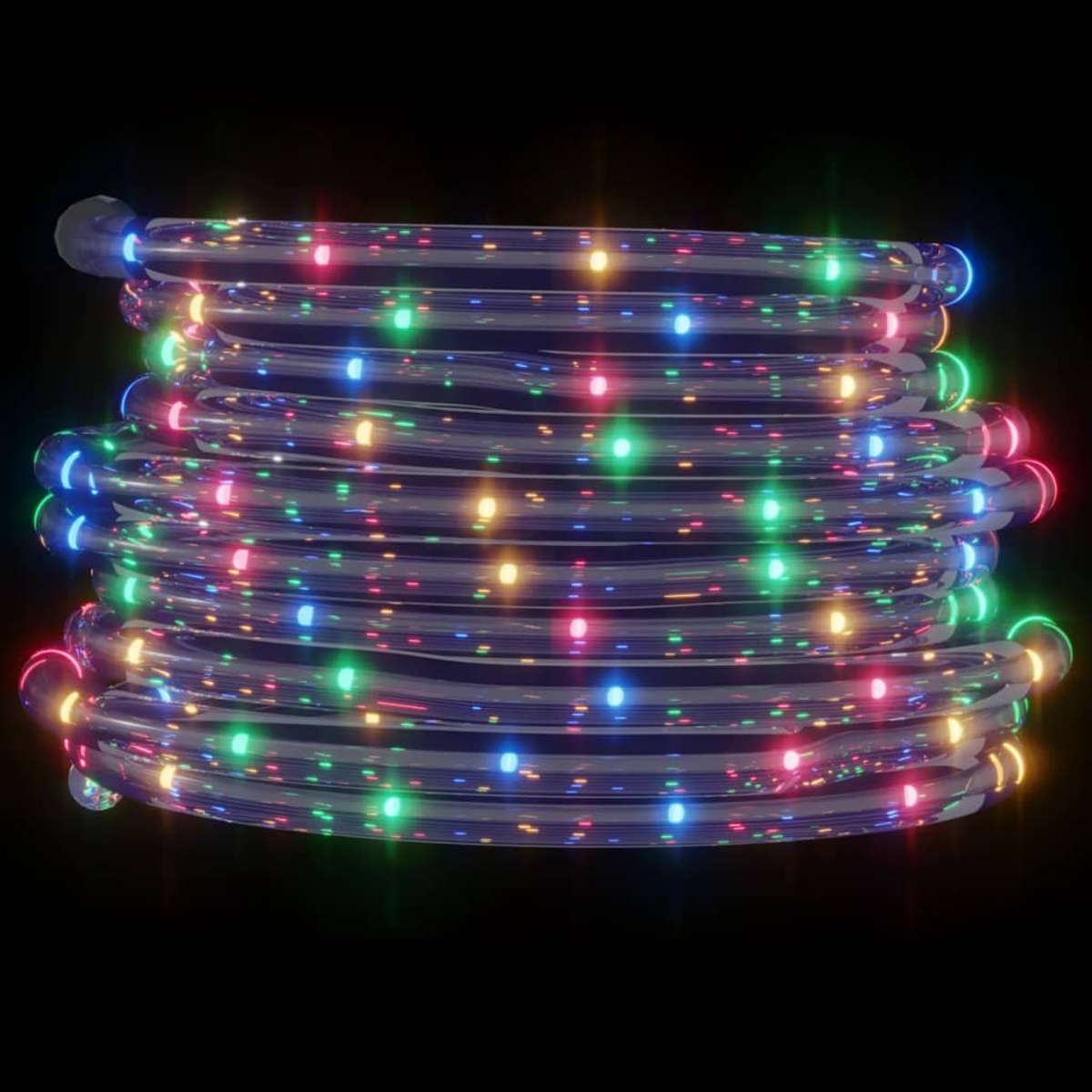 Eine aufgerollte Lichterkette mit roten, grünen, gelben und blauen Lichtern auf dunklem Hintergrund.