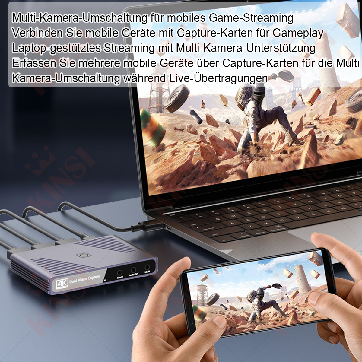 Eine Person hält ein Telefon mit einer Spielszene. Ein Laptop zeigt dasselbe Spiel. Eine Aufnahmekarte ist mit beiden verbunden.