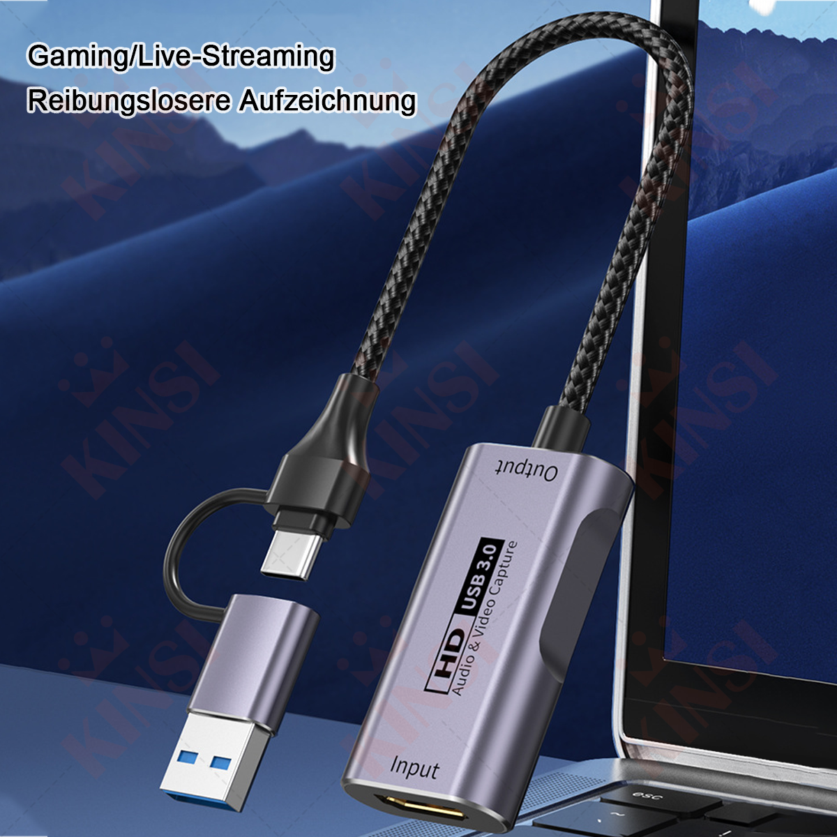 Ein HD USB 3.0 Audio- und Videoaufnahmegerät mit zwei Anschlüssen und einem geflochtenen Kabel, vor einem verschwommenen Laptop-Hintergrund.