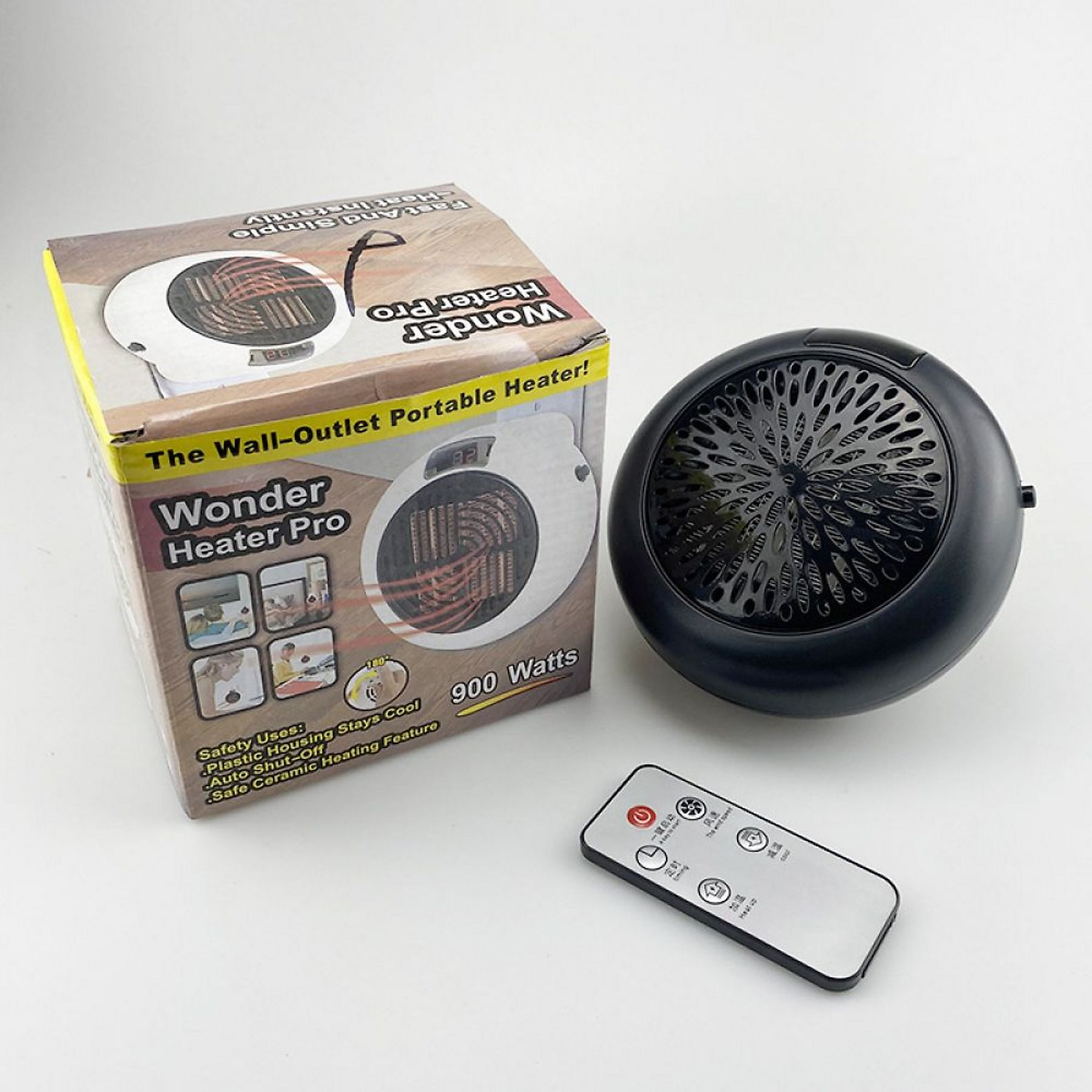 Eine schwarz-weiße Wonder Heater Pro Box und Heizung mit Fernbedienung. Auf der Box steht 'The Wall-Outlet Portable Heater!'