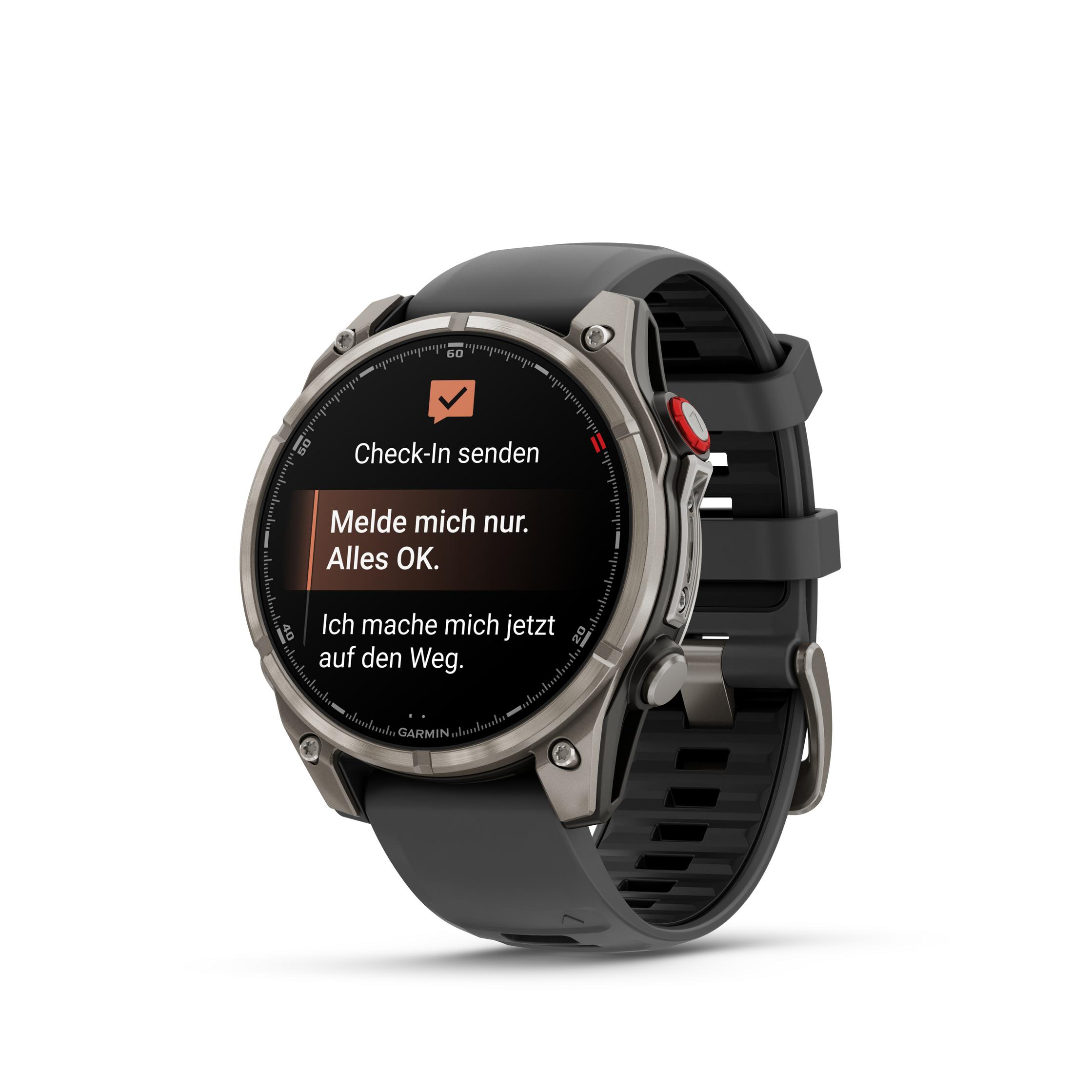 Une smartwatch Garmin affiche un message d'enregistrement. Elle a un bracelet noir et une lunette argentée, sur fond blanc.