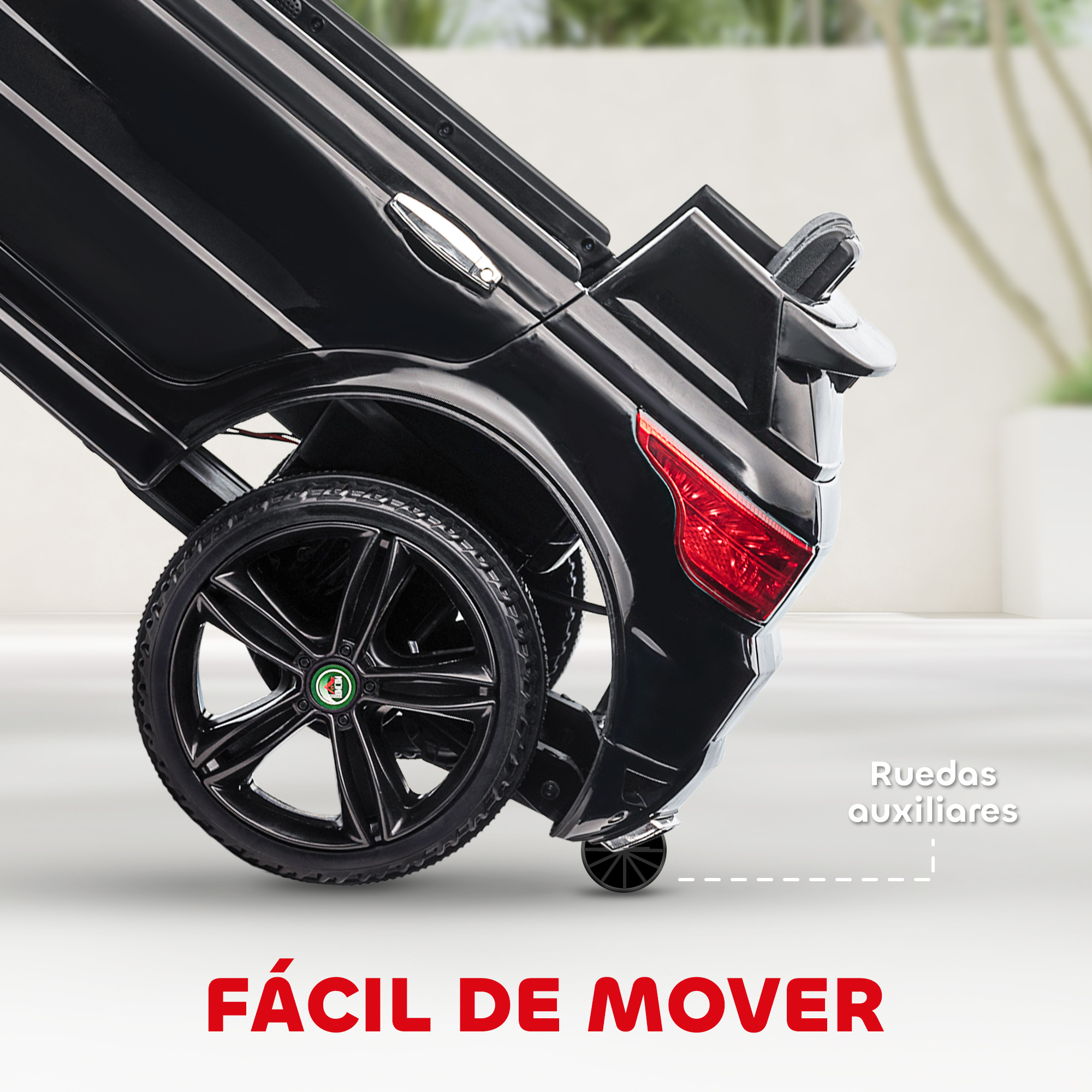 Un coche de juguete negro con ruedas negras, luz trasera roja y el texto 'FÁCIL DE MOVER' en rojo.