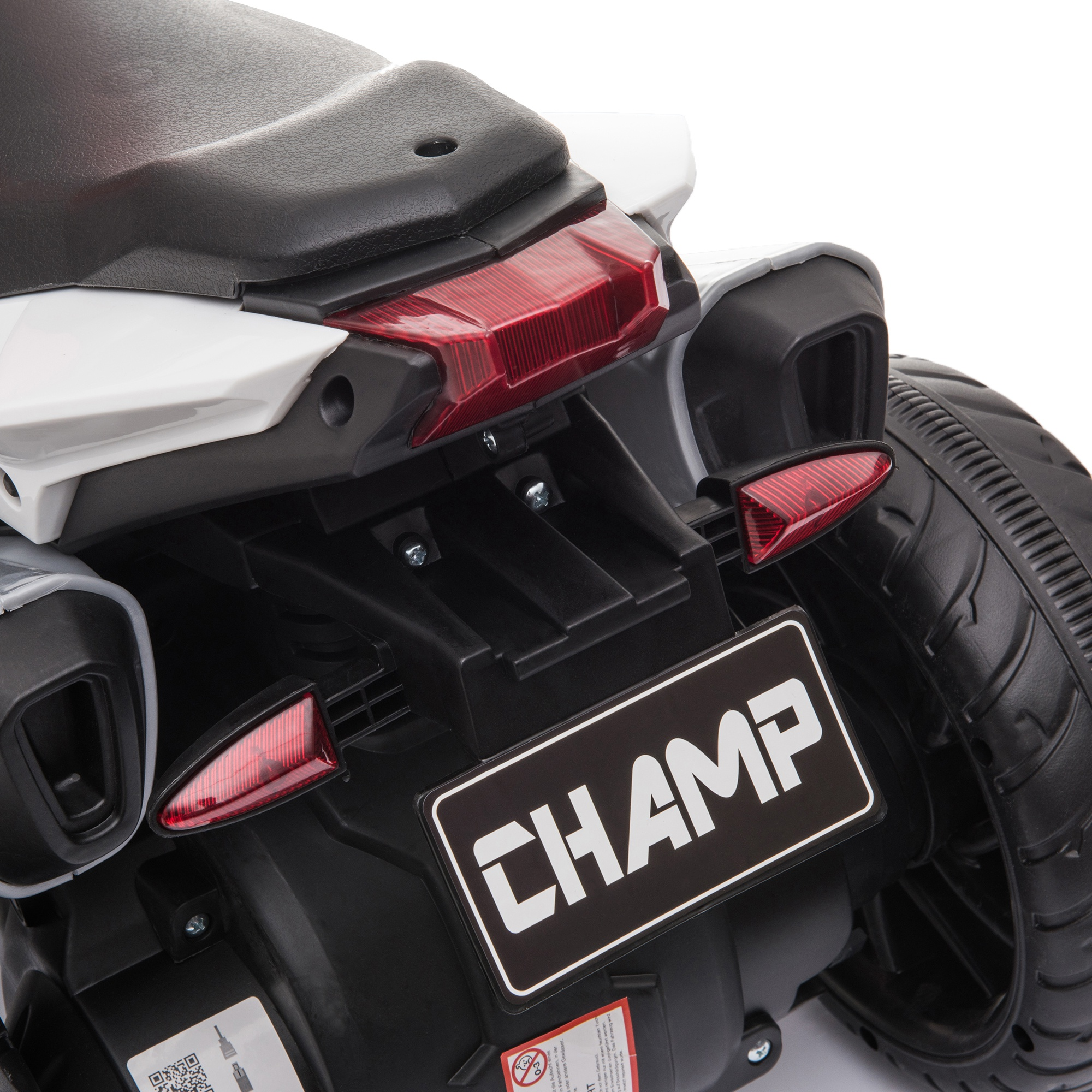 Vista trasera de una motocicleta de juguete con componentes negros y blancos, luces rojas y una placa que dice CHAMP.