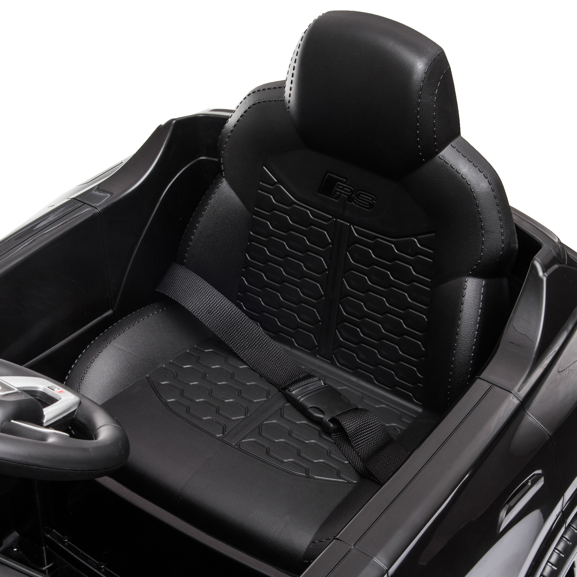 Interior negro de coche de juguete con asiento, reposacabezas y cinturón. El asiento tiene un logo RS.